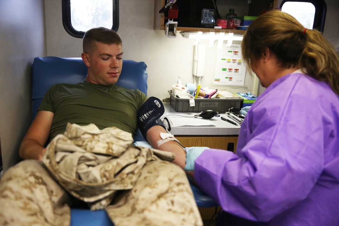 Lance Cpl. Nathan Campbell donates blood during the Armed Services Blood Program and Marine Corps Air Station Cherry Point Combined Federal Campaign’s blood drive at the air station Aug. 5, 2014. Campbell is a tactical air defense controller with Marine Air Control Squadron 2.  