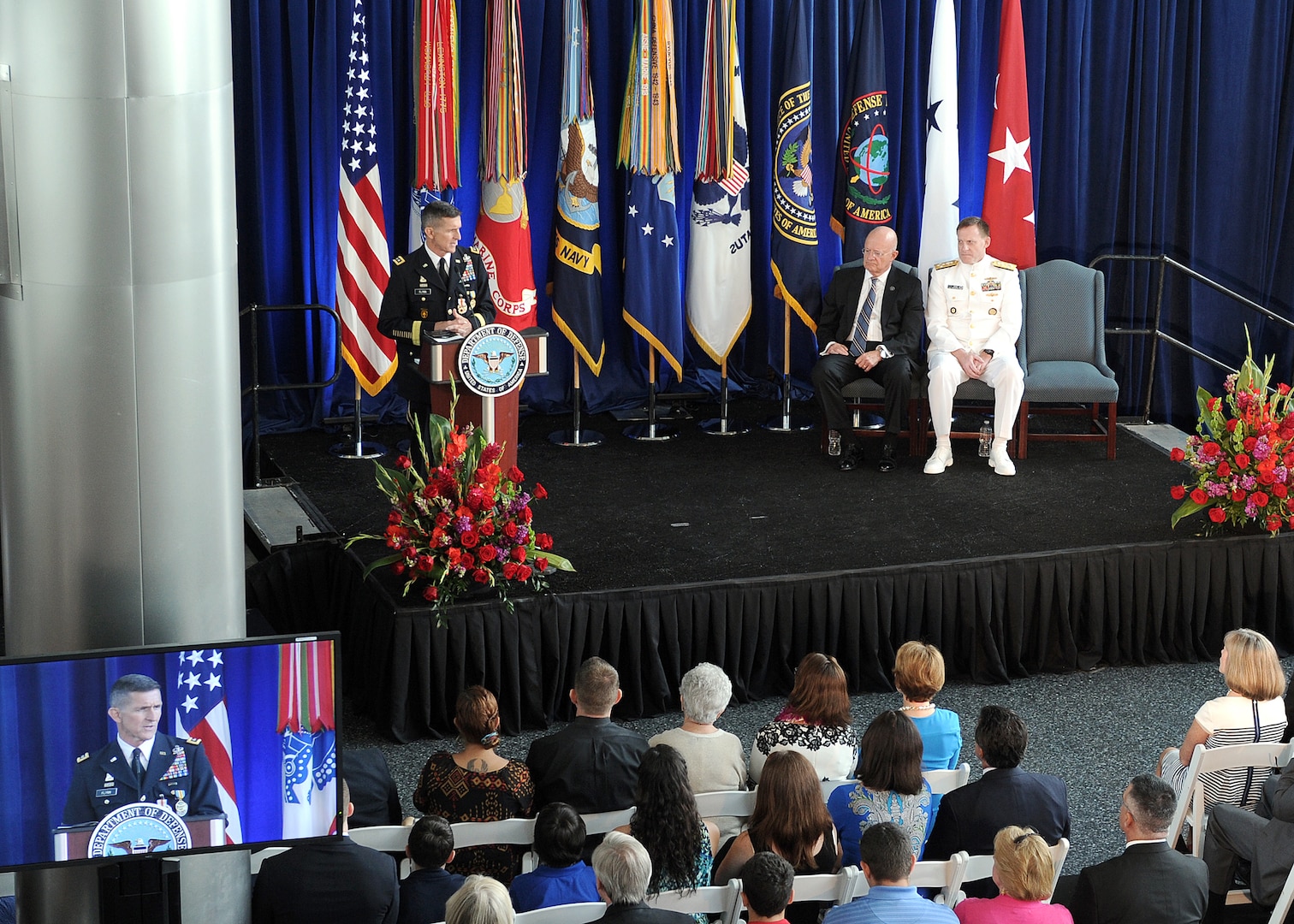 Lt. Gen. Michael Flynn speaks to family, friends and colleagues during his retirement ceremony at DIA Headquarters Aug. 7. Joining him on stage were Director of National Intelligence James Clapper and Director of the National Security Agency Adm. Michael Rogers.