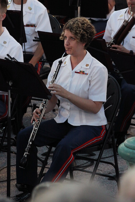 On June 5, 2014, Col. Michael J. Colburn conducted his last Marine Band concert as Director on the West Terrace of the U.S. Capitol in Washington, D.C. Pictured is oboe/English horn player Staff Sgt. Tessa Vinson. (U.S. Marine Corps photo by Master Sgt. Kristin duBois/released)