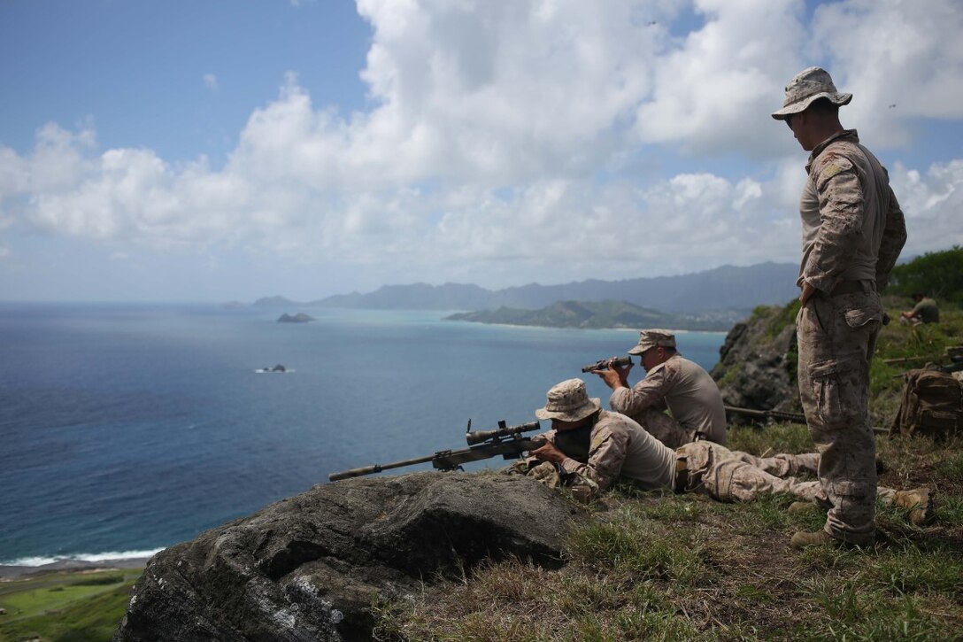 Marines with the 11th Marine Expeditionary Unit’s Reconnaissance Detachment, execute a high angle sniper range during their WESTPAC deployment on Marine Corps Base Hawaii, July 31, 2014. The 11th MEU and Makin Island Amphibious Ready Group are deploying as a sea-based, expeditionary crisis response force capable of conducting amphibious missions across the full range of military operations. (U.S. Marine Corps photo by Lance Cpl. Evan R. White/Released)