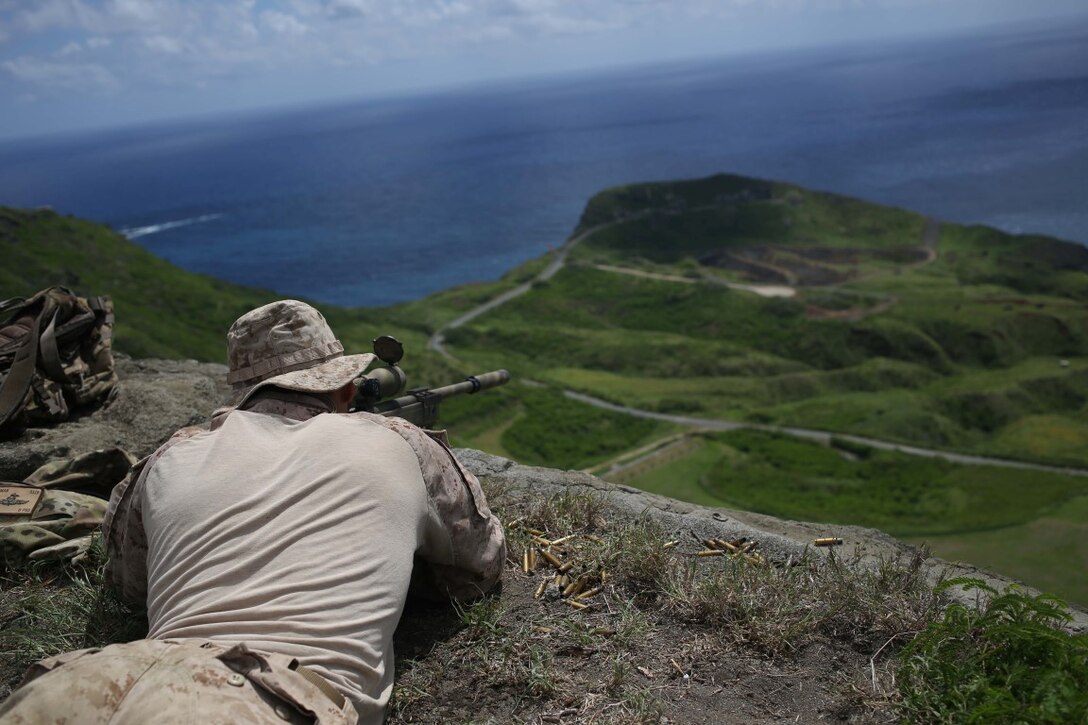 A Marine with the 11th Marine Expeditionary Unit’s Reconnaissance Detachment, executes a high angle sniper range during their WESTPAC deployment on Marine Corps Base Hawaii, July 31, 2014. The 11th MEU and Makin Island Amphibious Ready Group are deploying as a sea-based, expeditionary crisis response force capable of conducting amphibious missions across the full range of military operations. (U.S. Marine Corps photo by Lance Cpl. Evan R. White/Released)