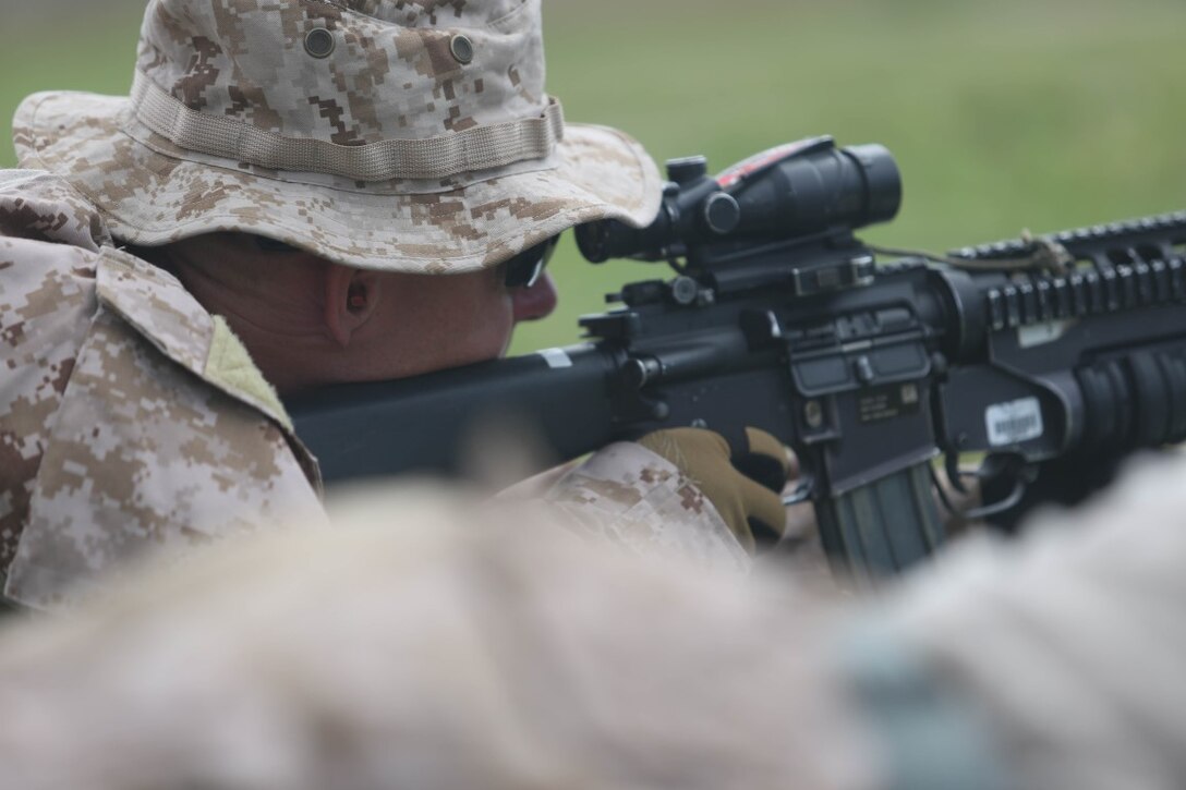 A Marine with the reconnaissance detachment, 11th Marine Expeditionary Unit, , conducts a battle zero as part of close quarters training on Marine Corps Base Hawaii, July 25, 2014. The 11th MEU and Makin Island Amphibious Ready Group are deployed as a sea-based, expeditionary crisis response force capable of conducting amphibious missions across the full range of military operations. (U.S. Marine Corps photo by Lance Cpl. Evan R. White/Released)
