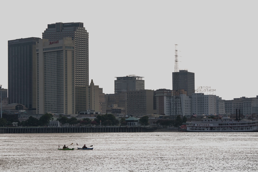 Nic Doucette and Gabe Vasquez, both retired Marines, kayak through the heart of New Orleans down the Mississippi River to honor the service of Sgt. Gabriel Martinez and Cpl. Justin Gaertner here, Aug. 6, 2014. Both Martinez and Gaertner stepped on pressure plate-activated improvised explosive devices while using their metal detectors in Afghanistan Nov. 26, 2010. Both Marines lost their legs but survived. New Orleans was the last major city Doucette and Vasquez passed through during their 2,552 mile journey from Lake Itasca, Minnesota to the Gulf of Mexico. (U.S. Marine Corps photo by Cpl. Codey Underwood)
