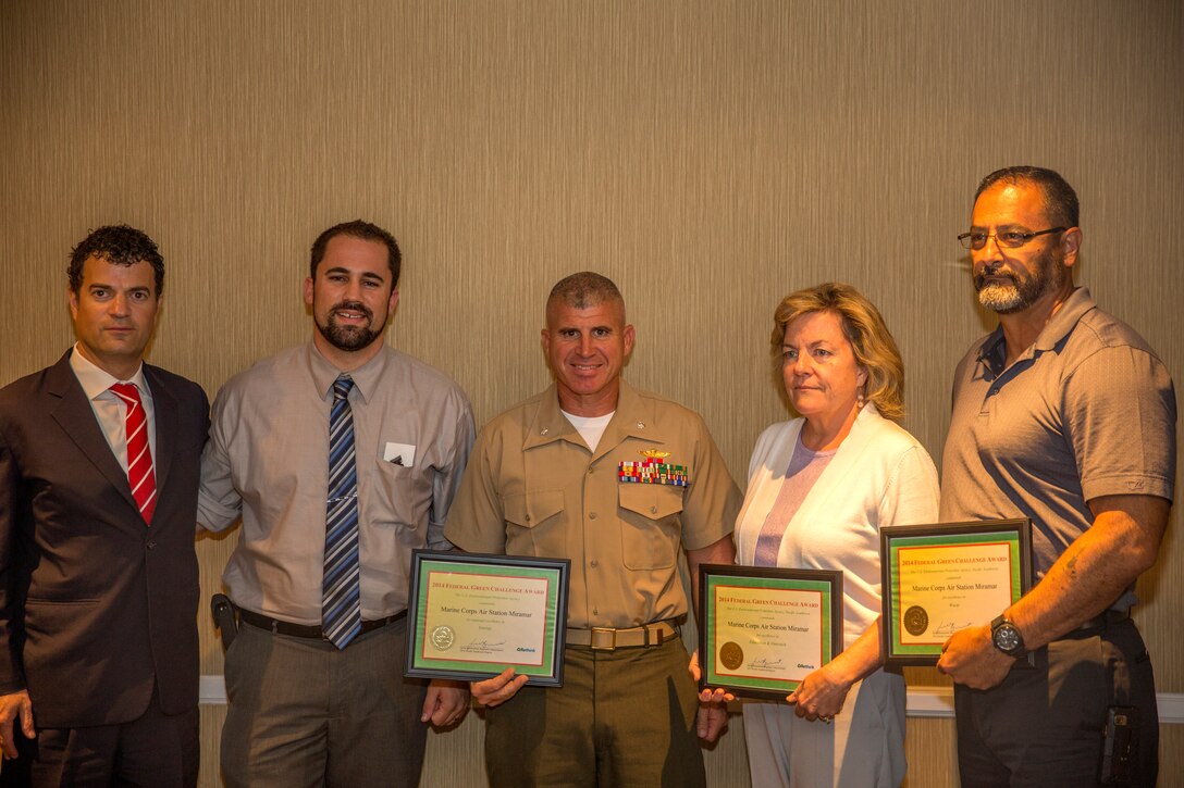 From left to right, Jared Blumenfeld, regional administrator with the United States Environmental Protection Agency for Region 9, Mick Wasco, installation energy manager, Lt. Col. Jon Davenport, director of Installations and Logistics, Susan Vanwinkle, remedial project manager, and Mike Corona, director of waste management, all with Marine Corps Air Station Miramar, pose with awards during the Federal Regional Council San Meeting in San Diego, Aug. 7. The EPA honored Marine Corps Air Station Miramar, Calif., along with Naval Base Coronado, Calif., and a Drug Enforcement Agency laboratory with the Federal Green Challenge Award for their efforts in conservation.