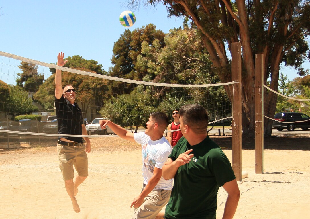 Marines of Recruiting Station San Francisco play a friendly game of volleyball aboard NASA Moffett Airfield in Mountain View, Calif. during the RS' Family Day, August 1, 2014. Family and friends joined the Marines to enjoy a well earned day off from their high operational tempo, after all 14 Recruiting Sub-Stations accomplished their mission in July.