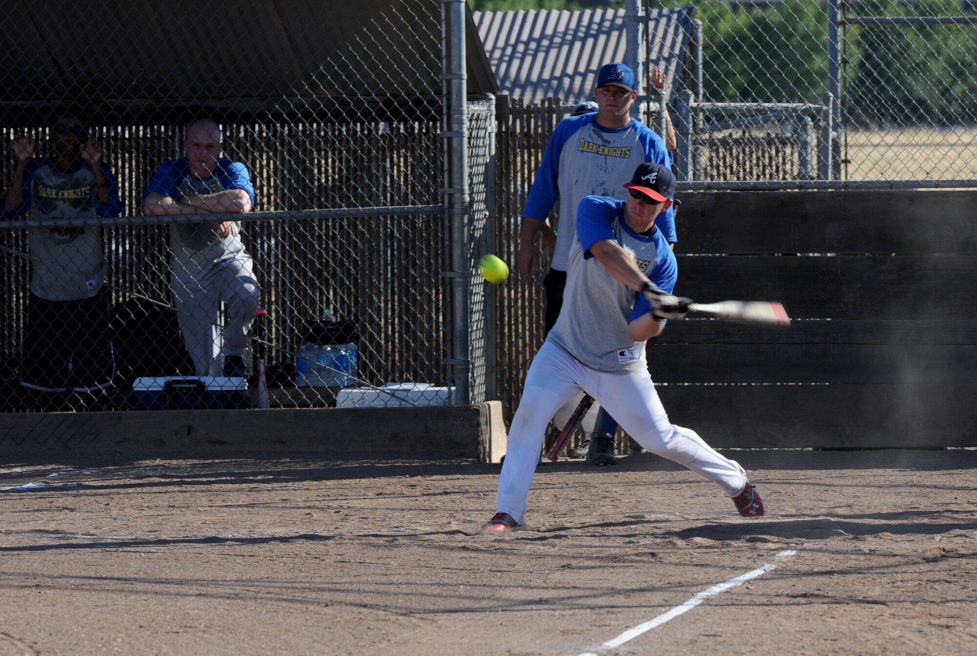 A member of the 13th Intelligence Squadron attempts to hit a softball at the 2014 Intramural Softball Championships at O’Malley Field on Beale Air Force Base, Calif., July 31, 2014. 9th Munitions defeated 13th IS, 19-4. (U.S. Air Force photo by Staff Sgt. Robert M. Trujillo/Released)