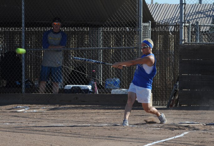 Staff Sgt. Candace Dugo, 9th Munitions Squadron, takes a swing during 2014 Intramural Softball Championships at O’Malley Field on Beale Air Force Base, Calif., July 31, 2014. 9th MUNS defeated 13th Intelligence Squadron, 19-4. (U.S. Air Force photo by Staff Sgt. Robert M. Trujillo/Released)
