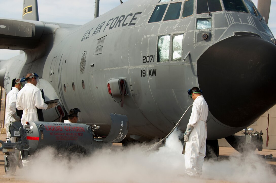SSgt Anthony Freeze, 362nd Training Squadron airlift instructor, trains his students on servicing a C-130 Hercules with liquid oxygen Aug. 5, 2014, at Sheppard Air Force Base, Texas. The liquid oxygen is extremely cold with a boiling point of negative 297 degrees Fahrenheit and will be apart of the Airmen's everyday tasks when they graduate technical school and join operational flight lines across the Air Force. (U.S. Air Force photo by Danny Webb/ Released)