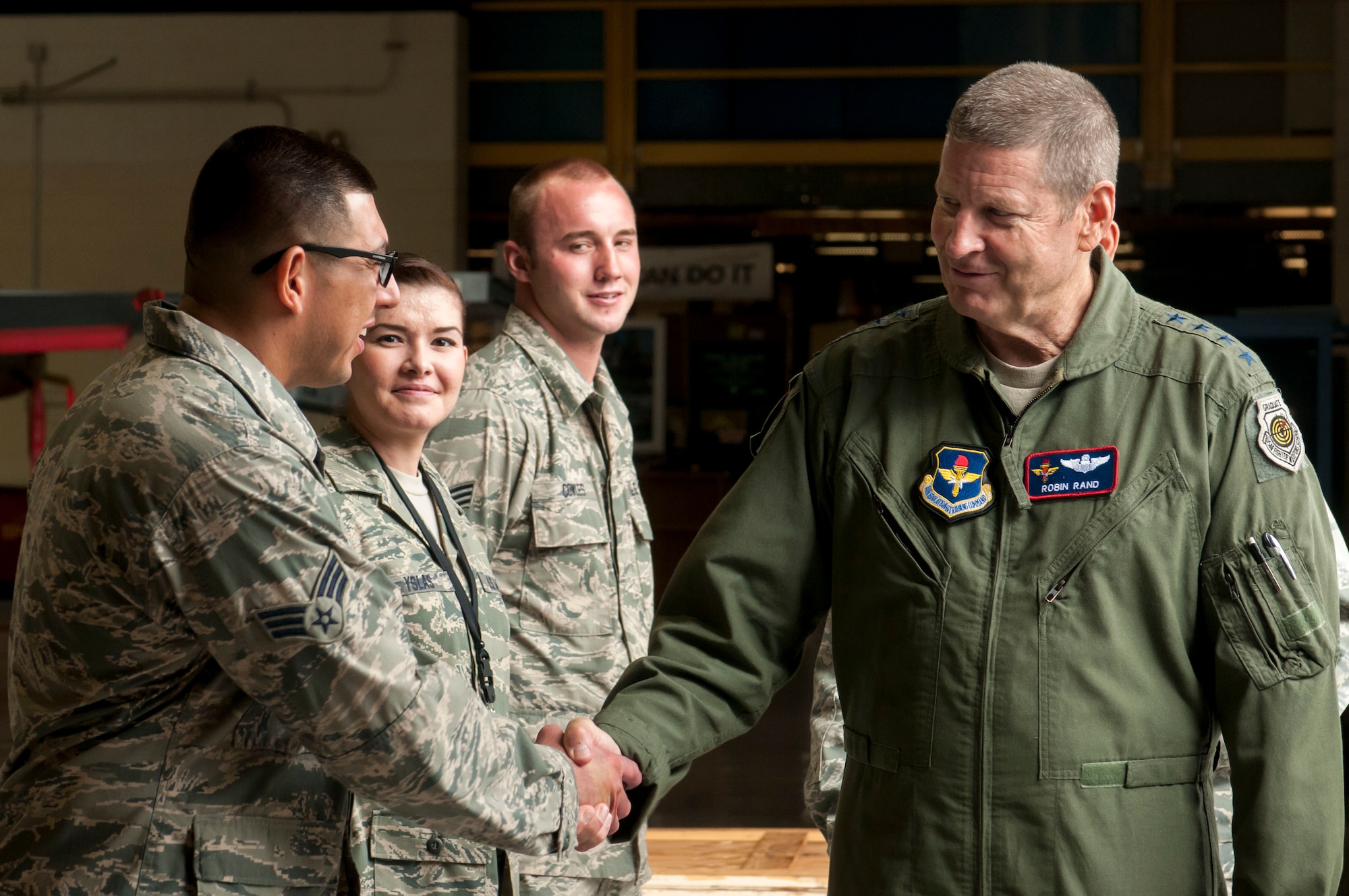 Gen. Robin Rand, Air Education and Training Command commander, greets some “Best of the Best” Citizen-Airmen, offering thanks and appreciation for their commitment to the Arizona National Guard and the United States. Rand visited the F-16 training unit at the Tucson International Airport during its August Unit Training Assembly. The visit is one of a 23-wing tour for the general and his command staff. AETC is responsible to recruit, train and educate Airmen to deliver airpower for America. (U.S. Air National Guard photo by Tech. Sgt. Hollie Hansen)