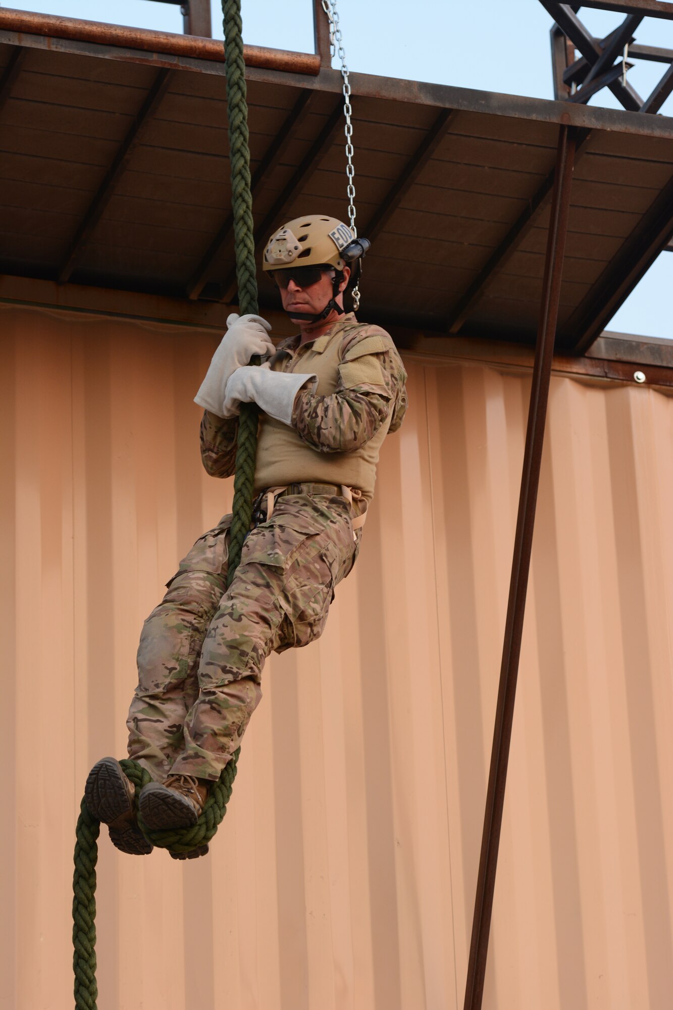 Master Sgt. Jeffery K. Martin, 155th Air Refueling Wing explosive ordnance disposal flight superintendent, slides down the fast rope during the 2014 PATRIOT exercise at Volk Field Air National Guard Base, Wis., July 20, 2014. He was an instructor for the younger EOD Airmen during the various exercises. (Air National Guard photo by Senior Airman Andrea F. Liechti)