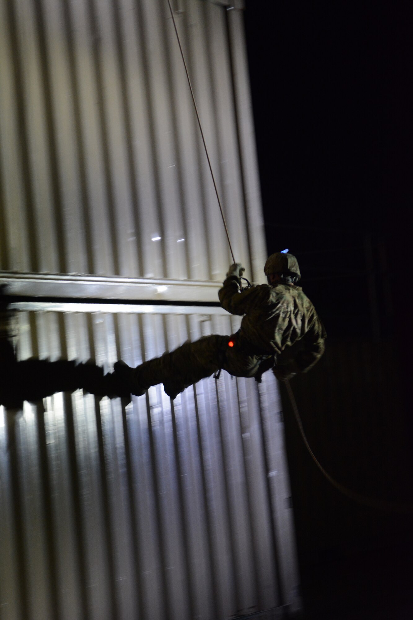 Airmen from the 115th Fighter Wing, 104th Fighter Wing and 155th Air Refueling Wing completed various rappelling activities during the 2014 PATRIOT exercise at Volk Field Air National Guard Base, Wis., July 20, 2014. The three units used the exercise to learn as much from each other as possible. The EOD Airmen learned how to tie proper knots for rappelling, participated in fast rope exercises, climbed a free-falling ladder, assembled and disassembled various bomb types, and received all-terrain vehicle training certification during their stay. (Air National Guard photo by Senior Airman Andrea F. Liechti)