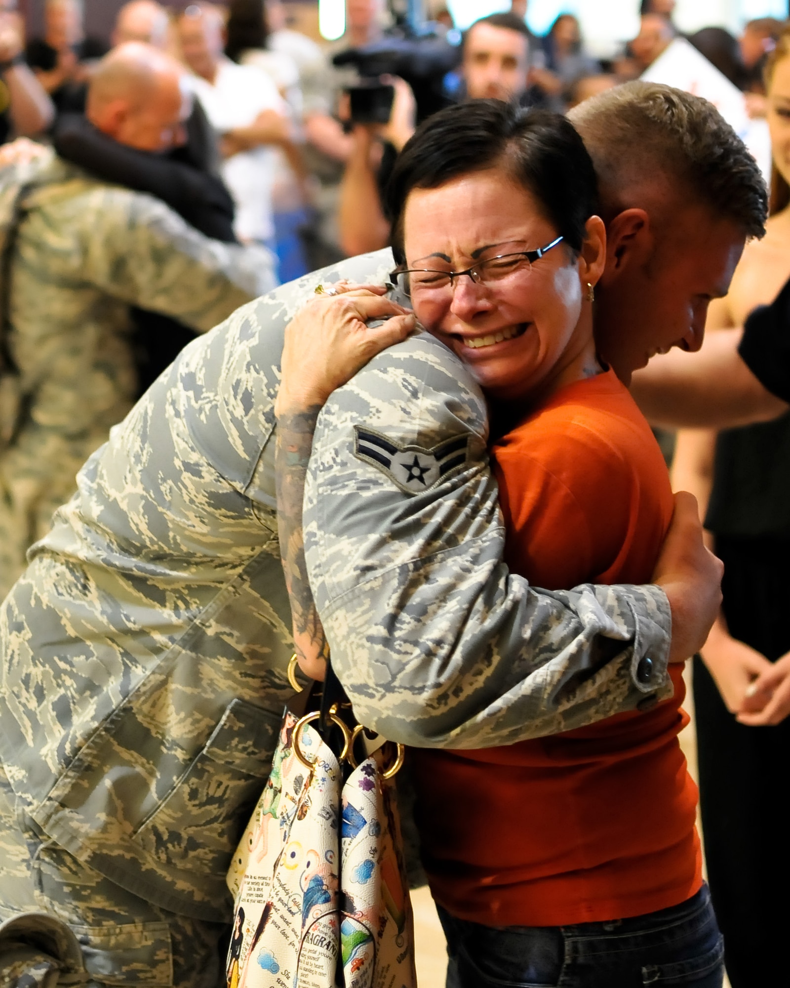 U.S. Air Force Senior Airman Jordan A.D. Sanford, security forces journeyman with the 182nd Security Forces Squadron, reunites with family and friends after arriving home at the General Wayne A. Downing Peoria International Airport in Peoria, Ill., Aug. 6, 2014. He and 17 Illinois Air National Guardsmen deployed to Southwest Asia for seven months in support of Operation Enduring Freedom. They were assigned to the 405th Expeditionary Security Forces Squadron overseas, where they were responsible for law enforcement and security missions in the region’s global war on terror. (U.S. Air National Guard photo by Staff Sgt. Lealan Buehrer/Released)