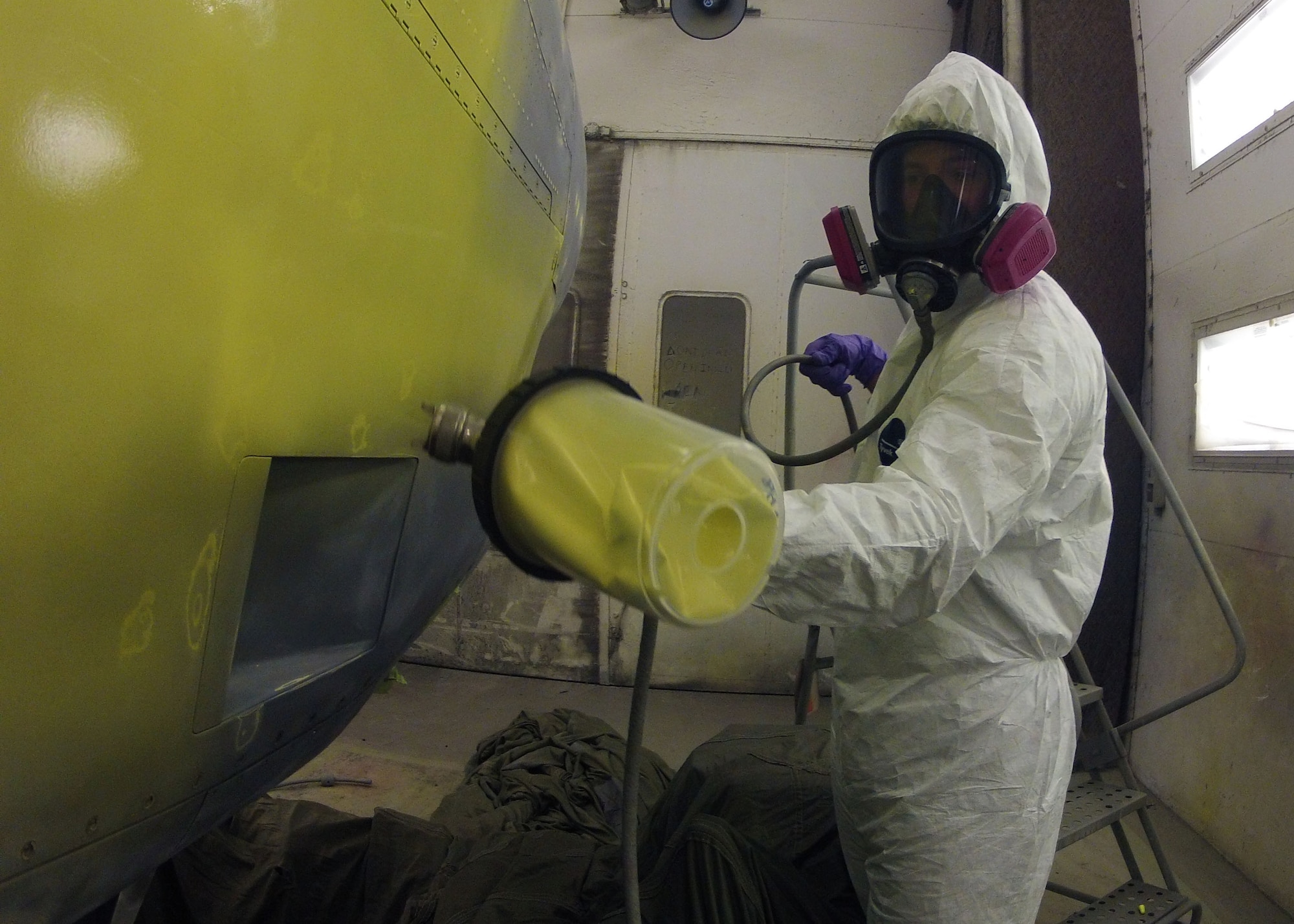 Senior Airman Charles Clark, a 19th Maintenance Squadron structural maintenance journeyman, applies primer to a C-130 engine July 17, 2014, at Little Rock Air Force Base, Ark. Primer is used to cover the old paint and helps the top coat bond to the metal. (U.S. Air Force photo by Airman 1st Class Scott Poe)