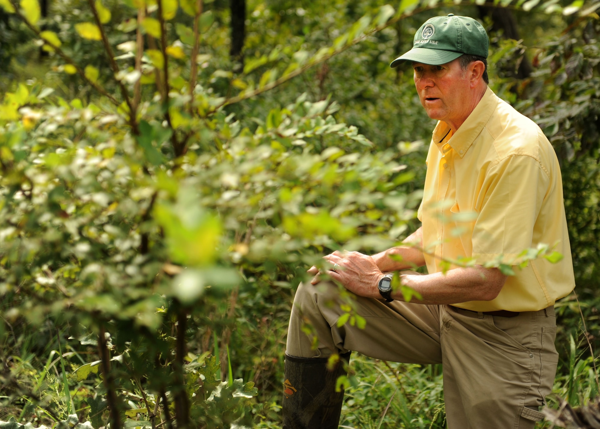 James Popham, the 19th Civil Engineer Squadron natural resources manager, takes a moment to gather his thoughts while looking for a rare species of moth July 24, 2014, at Little Rock Air Force Base, Ark. Little Rock AFB is home to several rare species of wildlife in the Natural State. (U.S. Air Force photo by Airman 1st Class Scott Poe) 