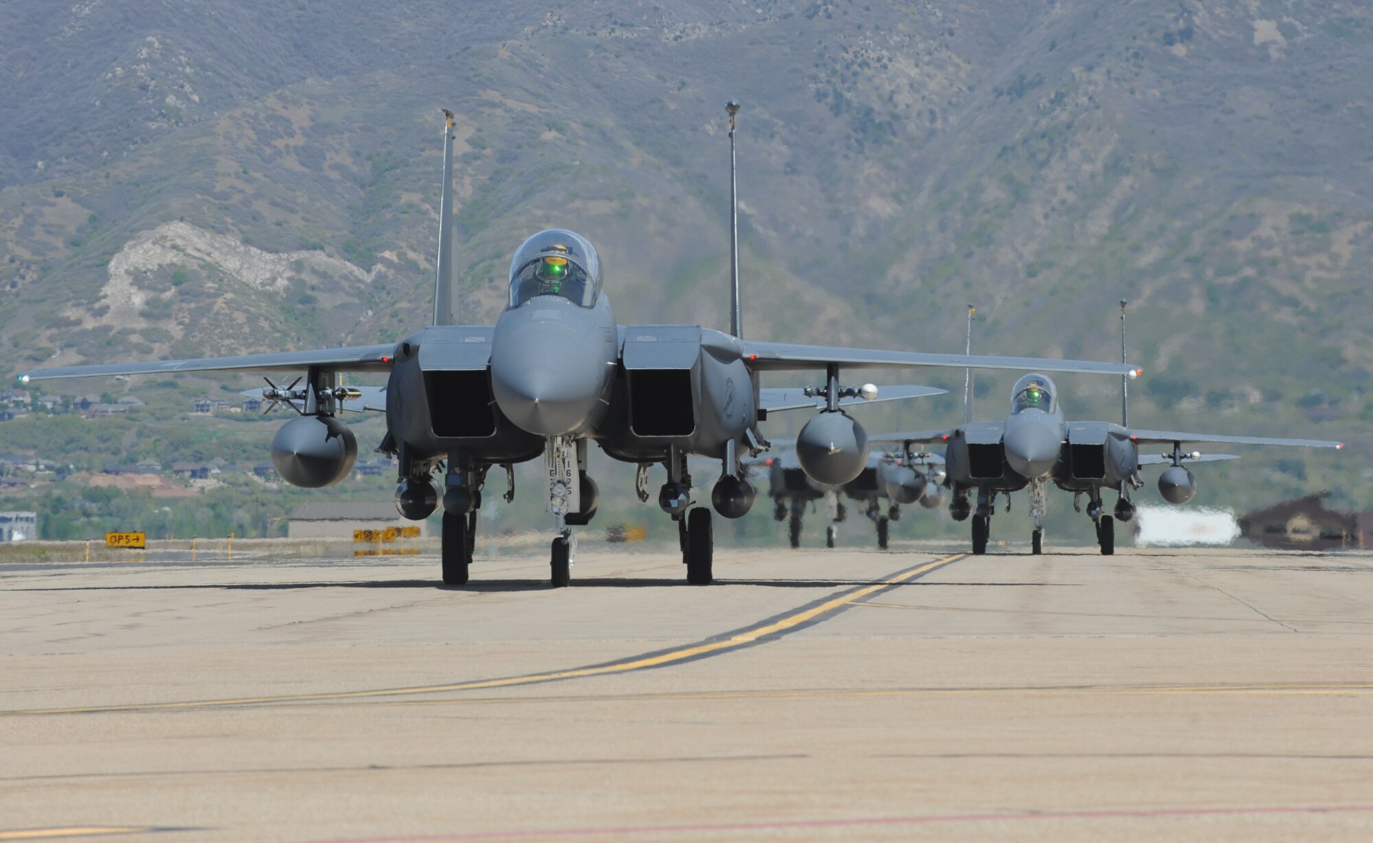 F-15Es from Seymour Johnson AFB, N.C., taxi at Hill AFB during the May 2014 Combat Hammer air-to-ground exercise. Residents around Hill AFB may notice an increase in aircraft arrivals and departures Aug. 11-22 as the U.S. Air Force air-to-ground exercise known as Combat Hammer and air-to-air exercise known as Combat Archer is conducted. (U.S. Air Force photo by Alex R. Lloyd)