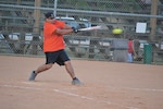 Defense Information Systems Agency first baseman Christopher Quintero, defense connect online tier 3 systems engineer, takes a swing in the fifth inning of the agency's matchup against the 453rd Electronic Warfare Squadron July 21 (U.S. afir Force Photo by Jose T. Garza III).