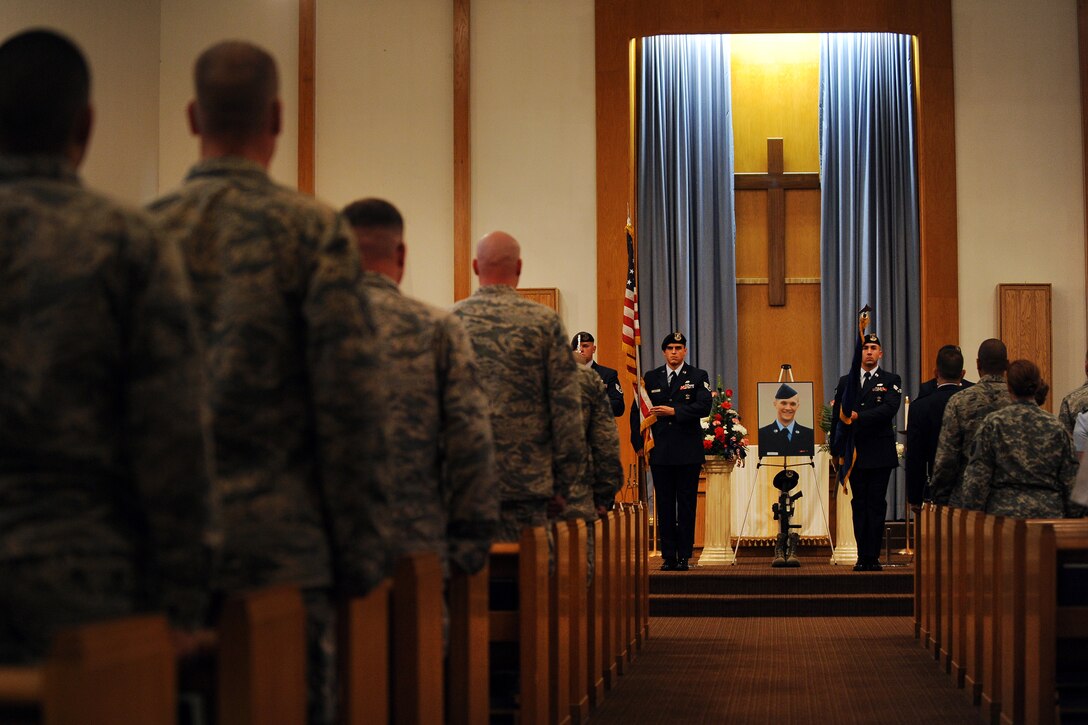 OFFUTT AIR FORCE BASE, Neb. -- The 55th Security Forces Squadron’s honor guard posts the colors at a memorial services held in honor of Airman 1st Class Anthony J. Michels at the Strategic Air Command Chapel on Aug. 8.  Michels was an elite guard defender with the 55th SFS who passed away on July 31. Hundreds of colleagues from around Team Offutt gathered at the chapel to pay their respects.  (U.S. Air Force photo by Josh Plueger/Released)