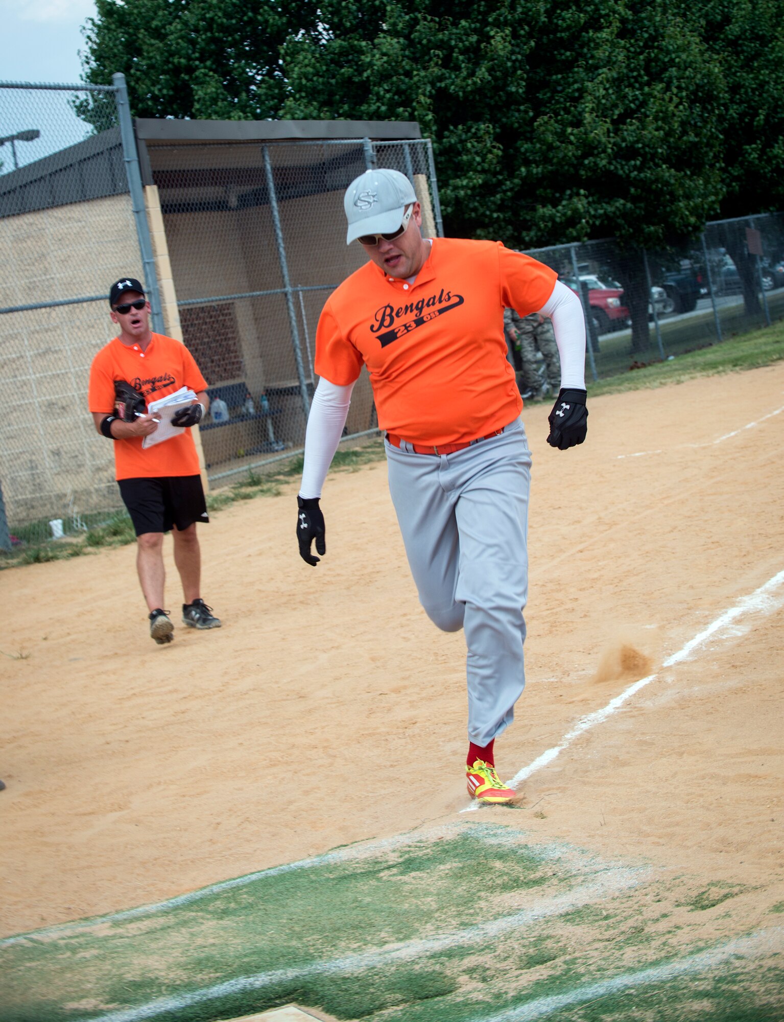 Stephan Price Jr., 23d Operations Support Squadron, runs to home plate during a softball game at Moody Air Force Base, Ga., Aug. 6, 2014. Price is one of two coaches for the 23d OSS intramural softball team. (U.S. Air Force photo by Senior Airman Jarrod Grammel/Released)
