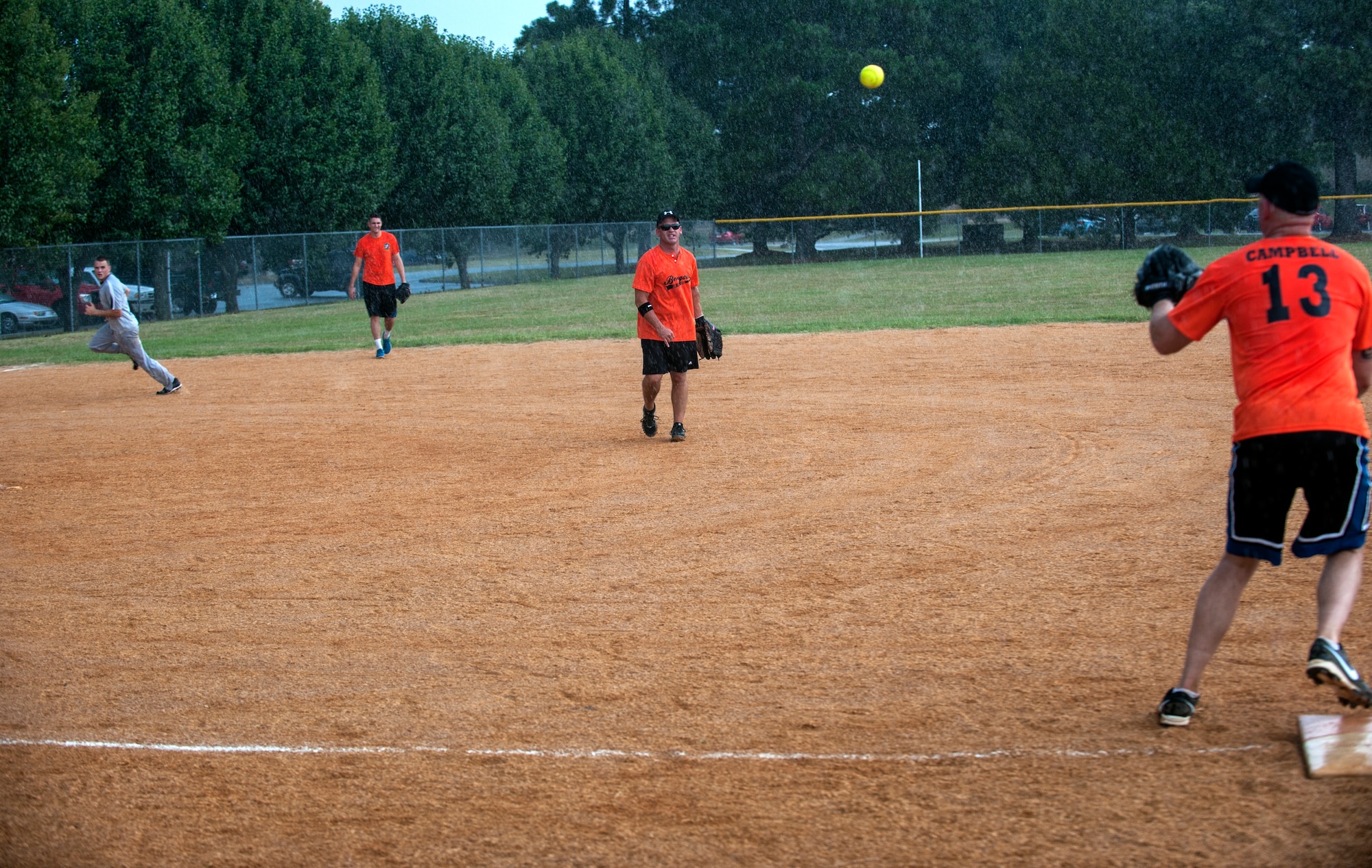The 23d Operations Support Squadron tries to stop the 723d Aircraft Maintenance Squadron as they make a base run at Moody Air Force Base, Ga., Aug. 6, 2014. This was the second day of the 2014 intramural softball playoffs, with the championship game scheduled for Sept. 3, 2014.  (U.S. Air Force photo by Senior Airman Jarrod Grammel/Released)
