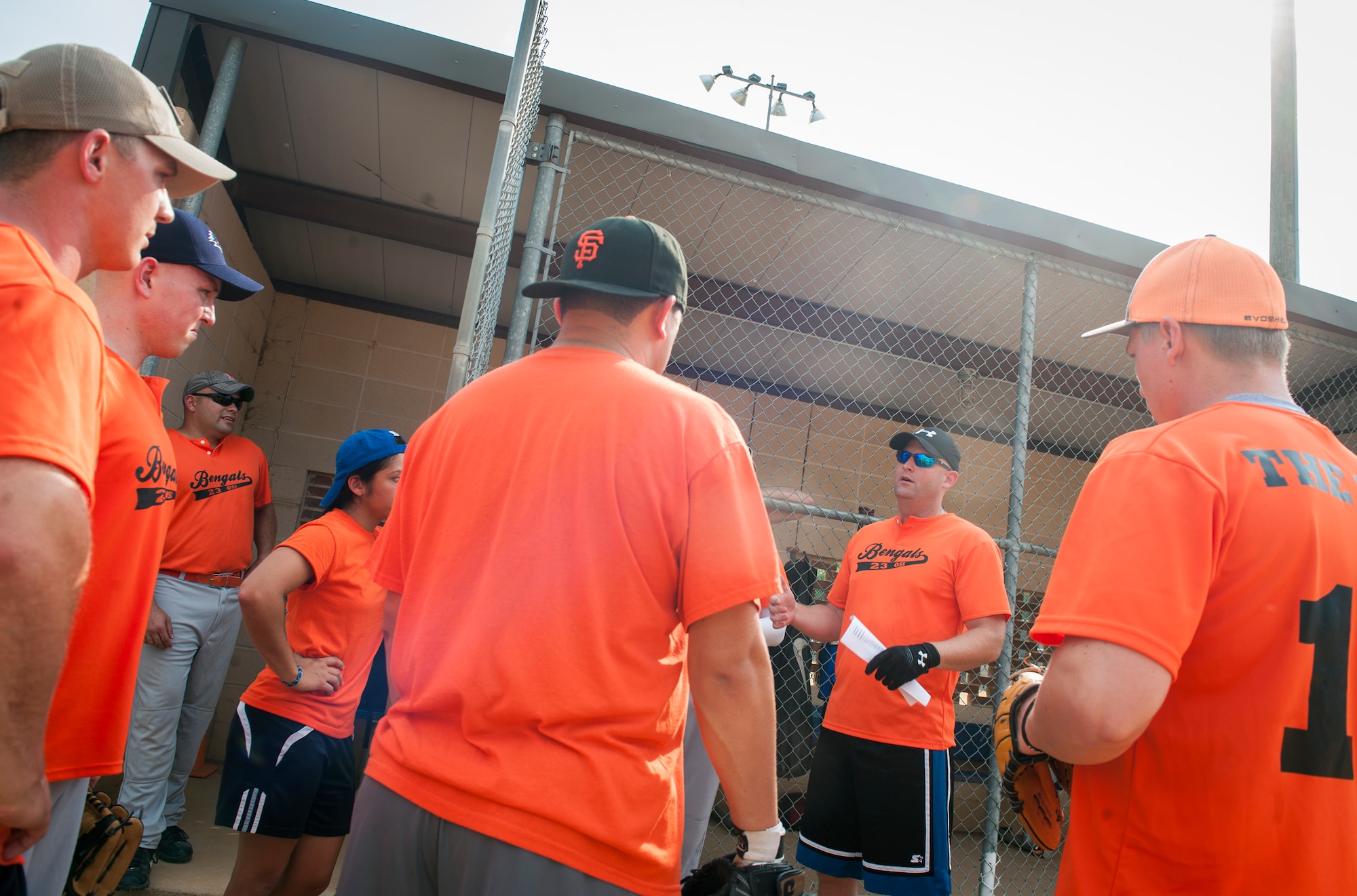 The 23d Operations Support Squadron softball team strategizes before the start of a game at Moody Air Force Base, Ga., Aug. 6, 2014. The 23d OSS played the 723d Aircraft Maintenance Squadron for their second game of the playoffs. (U.S. Air Force photo by Senior Airman Jarrod Grammel/Released)
