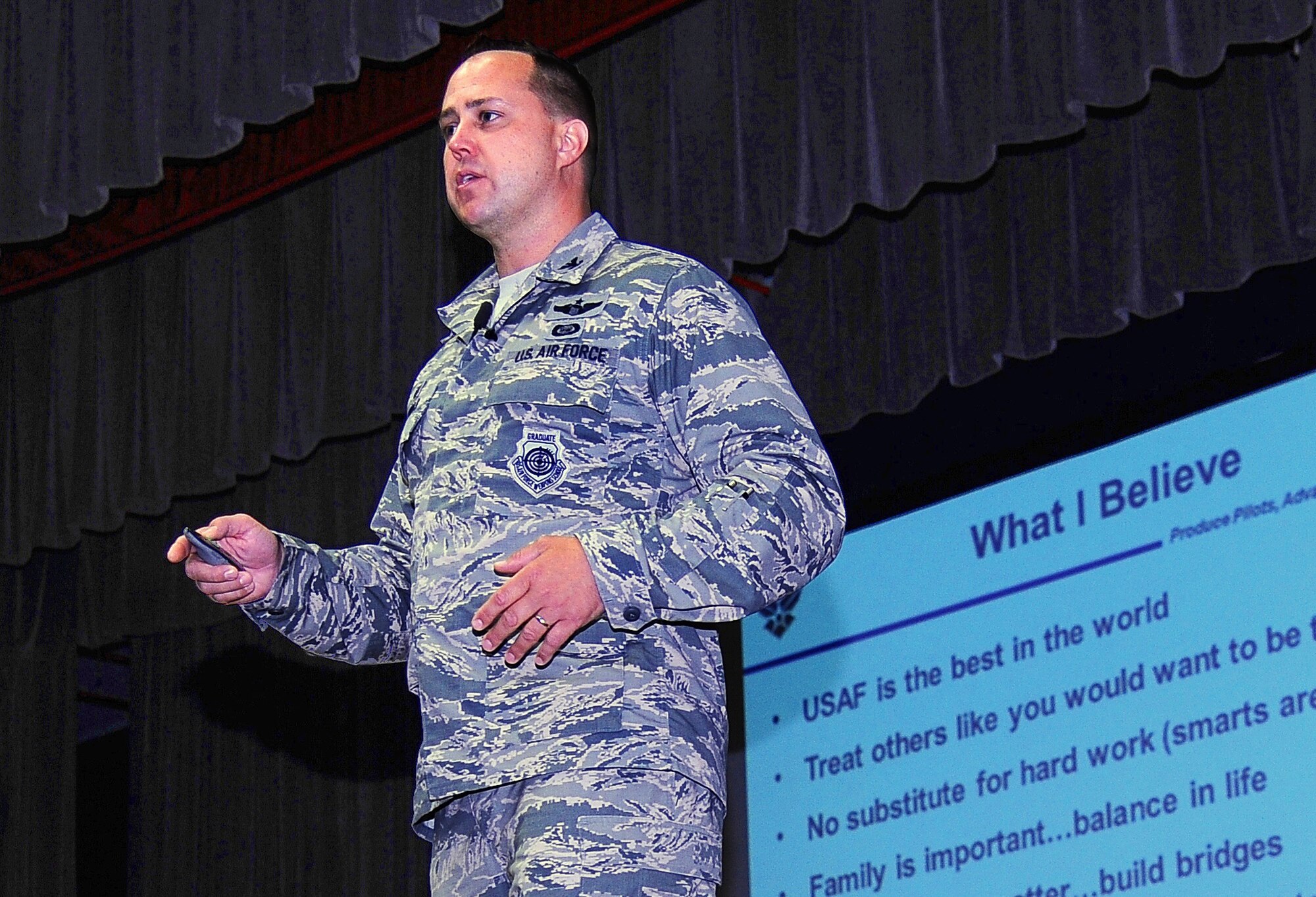 Col. John Nichols, 14th Flying Training Wing Commander, speaks during a Commander’s Call at the Kaye Auditorium, Aug 1. Nichols expressed his gratitude, concerns and plans for the future of Team BLAZE. He also emphasized a few things he felt were important including respect and discipline. (U.S. Air Force photo/ Airman 1st Class Daniel Lile)