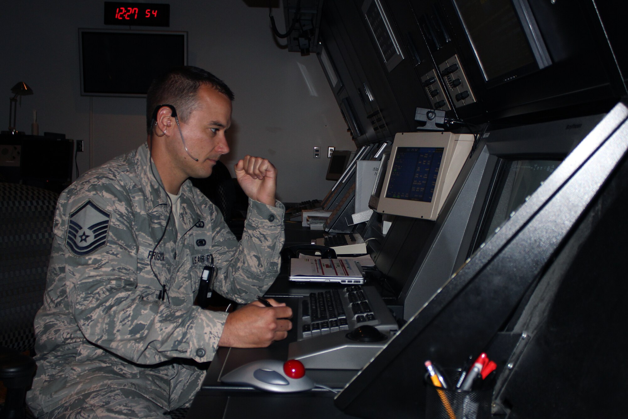 1. Master Sgt. Brian Frisch works as an air traffic controller in the radar approach control room at the Alpena Combat Readiness Training Center during Operation Northern Strike, Aug. 5, 2014. Frisch is permanently assigned to the Alpena CRTC as a member of the Michigan Air National Guard. Twenty-four units from 12 states and two coalition partners will participate in the three-week event.  Operation Northern Strike will occur from Aug. 4 - 22, 2014, at the Alpena Combat Readiness Training Center and Camp Grayling Joint Maneuver Training Center. More than total Force fighter, bomber, mobility, and rotary sorties are planned in support of live fire exercises in order to meet stated objectives for participating units. (U.S. Air National Guard photo by Tech. Sgt. Dan Heaton)
