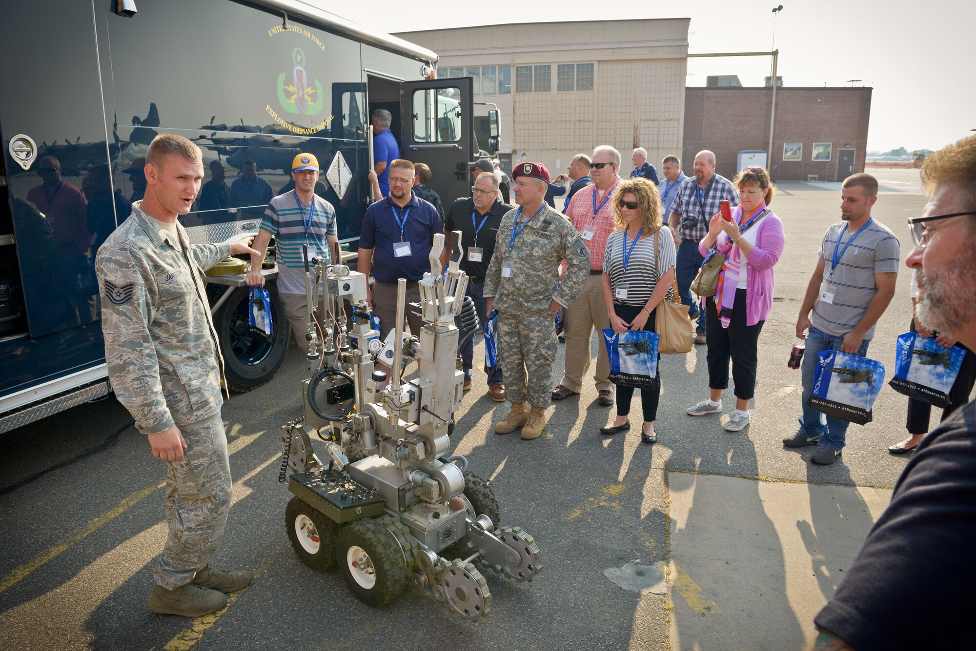 Tech. Sgt. Adam Janssen, 934th Explosive Ordnance Disposal Flight, explains the EOD mission to civilian employers of 934th Airlift Wing Reservists during Employers' Day Aug. 2.   The annual event allows employers to to see what their employees do during Unit Training Assembly weekends, learn more about the Reserve mission, and gain a greater understanding of what it means for their employee(s) to be a member of the 934 AW.  (U.S. Air Force photo/Paul Zadach)