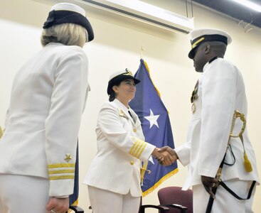 Cmdr. Michael Briggs (right) is congratulated by Capt. Susanne McNinch (center), commodore of Navy Recruiting Region West, after assuming command of Navy Recruiting District San Antonio from Cmdr. Corry Juedeman (left) during a change of command July 25 at Anderson Hall, Medical Education and Training Campus, Joint Base San Antonio-Fort Sam Houston.
Photo by Burrell Parmer