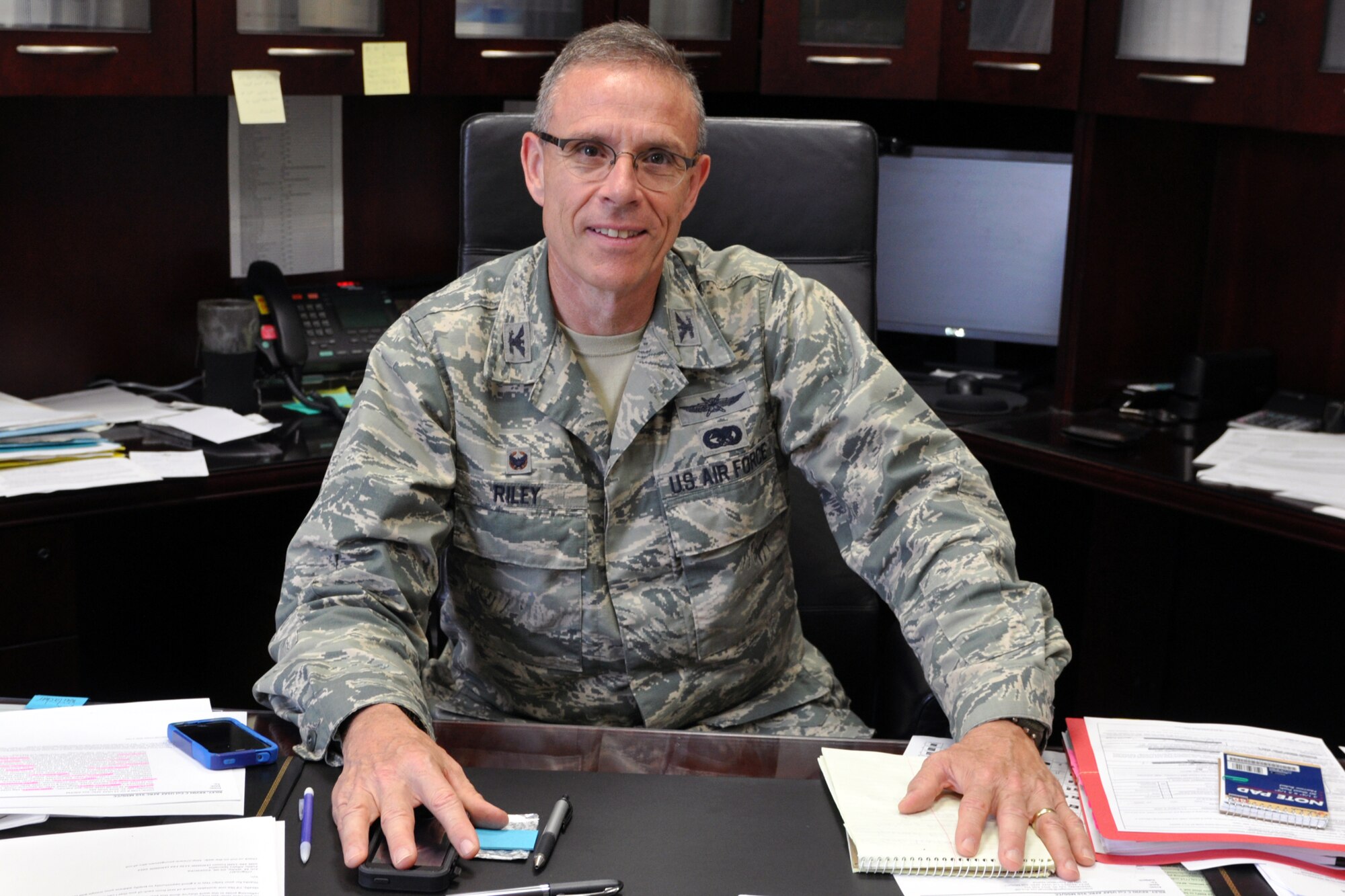 U.S. Air Force Reserve Col. Kevin C. Riley, 910th Mission Support Group commander, stops working for a moment for an interview here, August 2, 2014. Riley recently assumed command of the Mission Support Group at Youngstown Air Reserve Station. U.S. Air Force photo/Tech. Sgt. Valerie Smock.