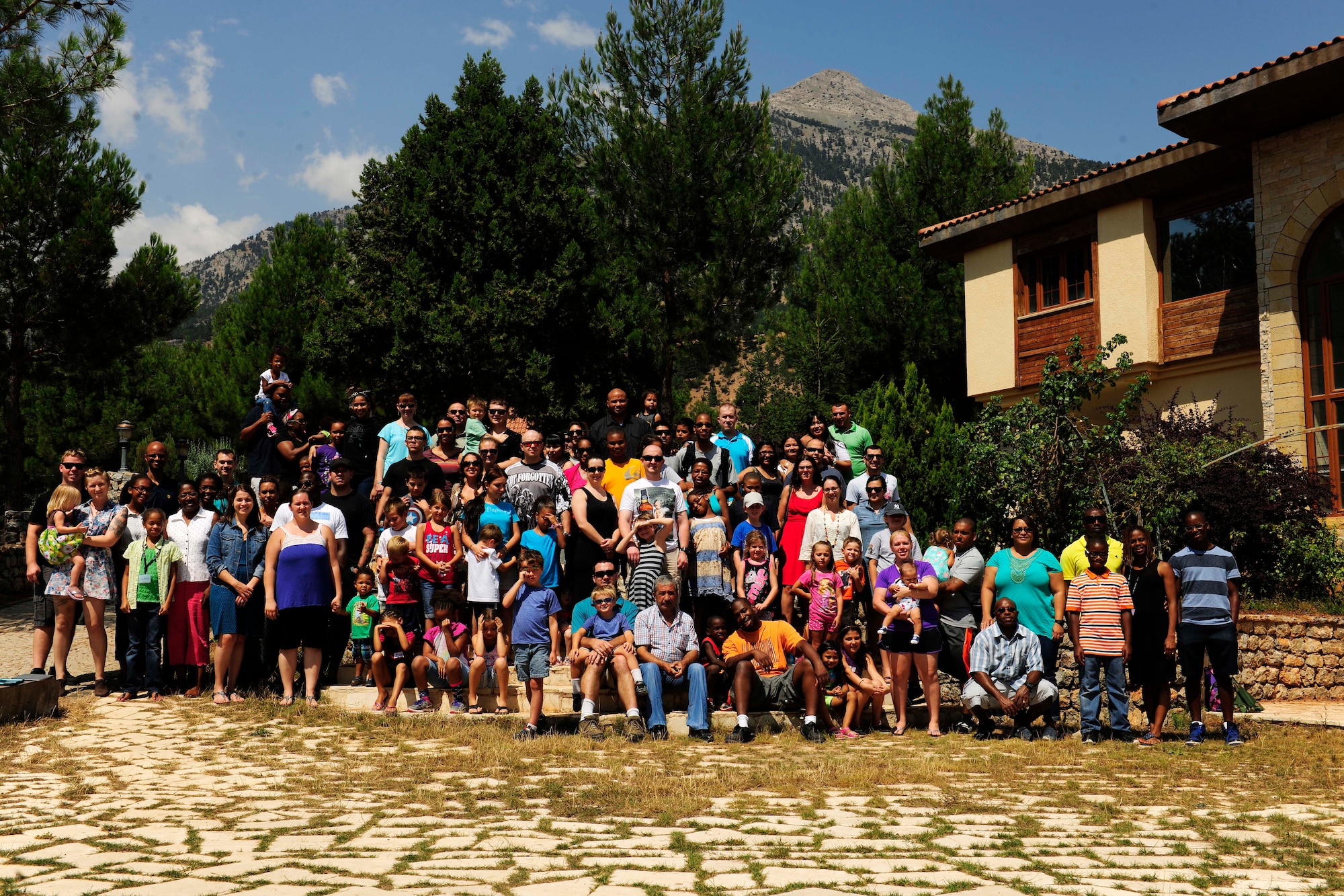 Family retreat attendees take a group photo July 27, 2014, Pozanti, Turkey. The families spent the weekend in the mountains of Pozanti and attended learning sessions which included both parents and children. (U.S. Air Force photo by Staff Sgt. Eboni Reams/Released)