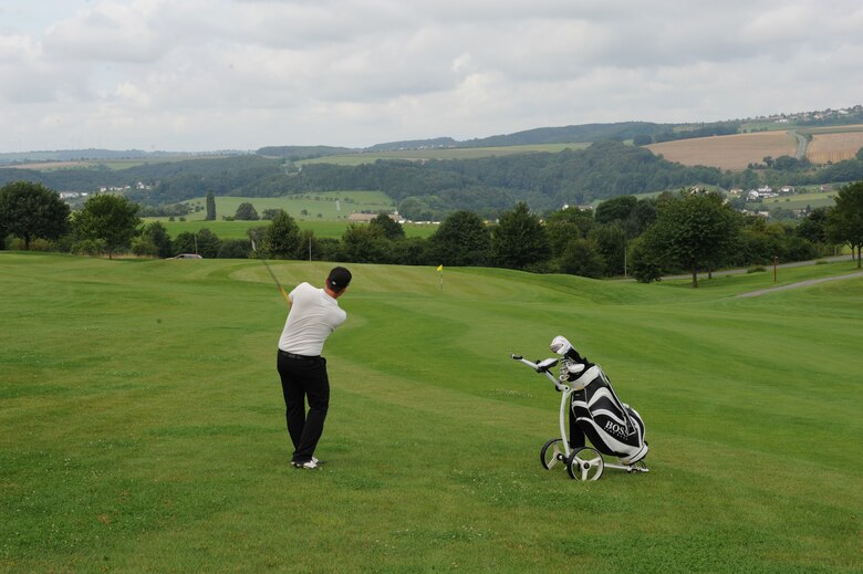 A Bitburger Land Golf Course team member hits a shot during the Bitburgerland Ryder Cup tournament Aug. 3, 2014, at Bitburger Land Golf Course in Bitburg, Germany. Organizers held the two-day tournament at both the Eifel Mountain Golf Course on Spangdahlem Air Base, Germany and the Bitburger Land Golf Course. (U.S. Air Force photo by Airman 1st Class Dylan Nuckolls/Released)