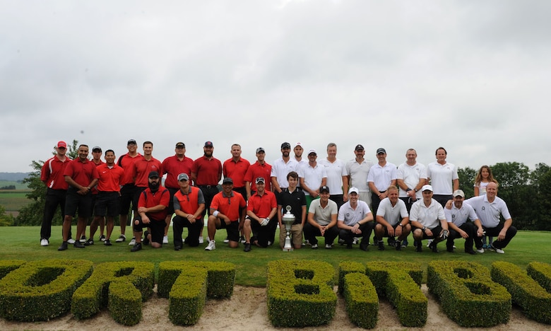 Participants from the Eifel Mountain Golf Course team and Bitburger Land Golf Course team pose for a photo Aug. 3, 2014, at Bitburger Land Golf Course in Bitburg, Germany. Several Sabers from Spangdahlem Air Base, Germany, took part in the Bitburgerland Ryder Cup tournament during the two-day tournament. (U.S. Air Force photo by Airman 1st Class Dylan Nuckolls/Released)