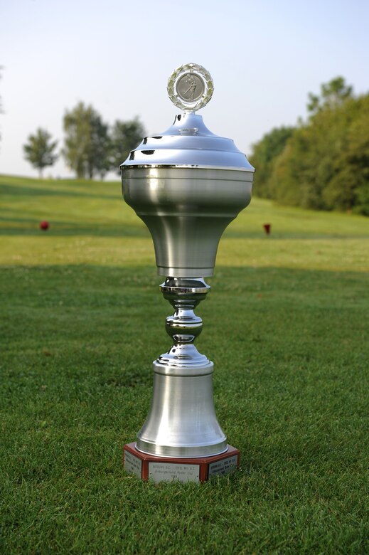 The Bitburgerland Ryder Cup tournament trophy sits on the first tee box July 27, 2014 at the Eifel Mountain Golf Course at Spangdahlem Air Base, Germany. Each team had 14 players compete to earn the needed 14.5 points to win the match. The Eifel Mountain Golf Course team from Spangdahlem Air Base, Germany, won this year’s tournament with 17 points. (U.S. Air Force photo by Airman 1st Class Dylan Nuckolls/Released)