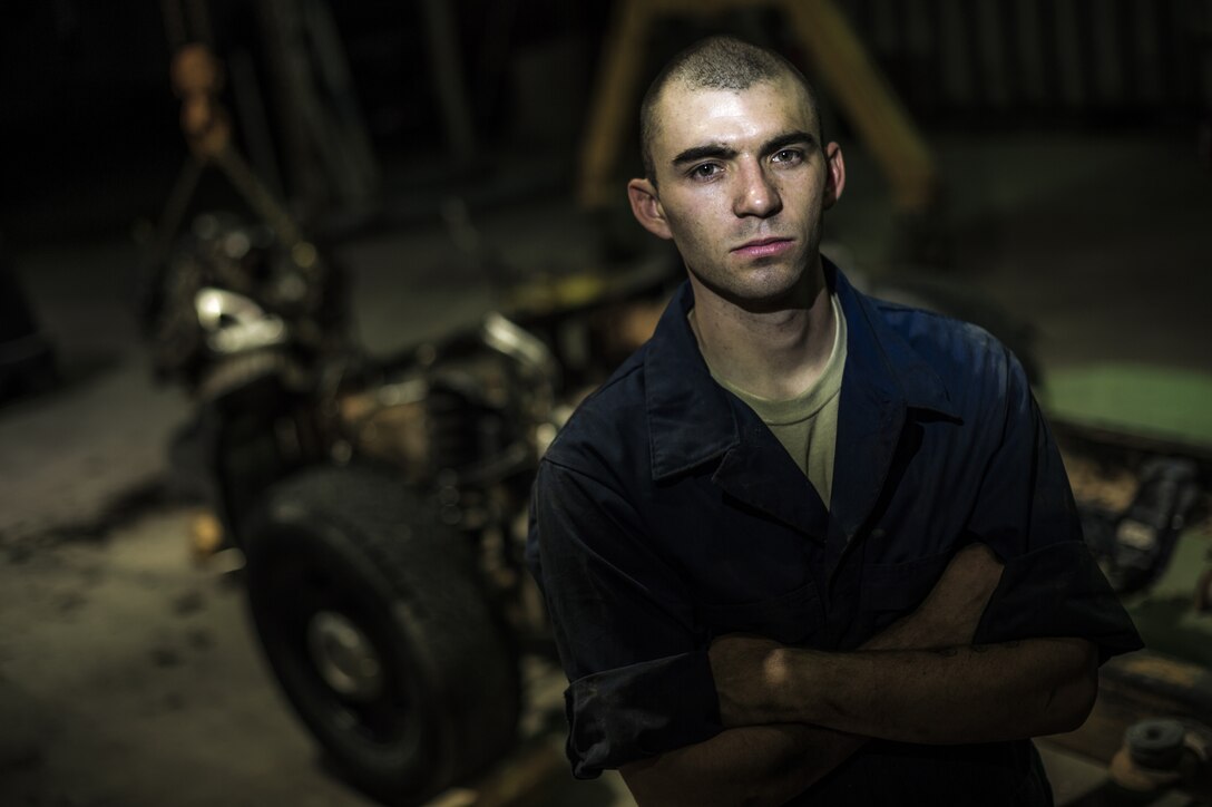 Senior Airman Christopher Moore has been a mechanic for the Air Force for three years and is deployed to Southwest Asia from the 86th Vehicle Readiness Squadron, Ramstein Air Base, Germany, in support of Operation Enduring Freedom. U.S. Air Force photo by Staff Sgt. Jeremy Bowcock