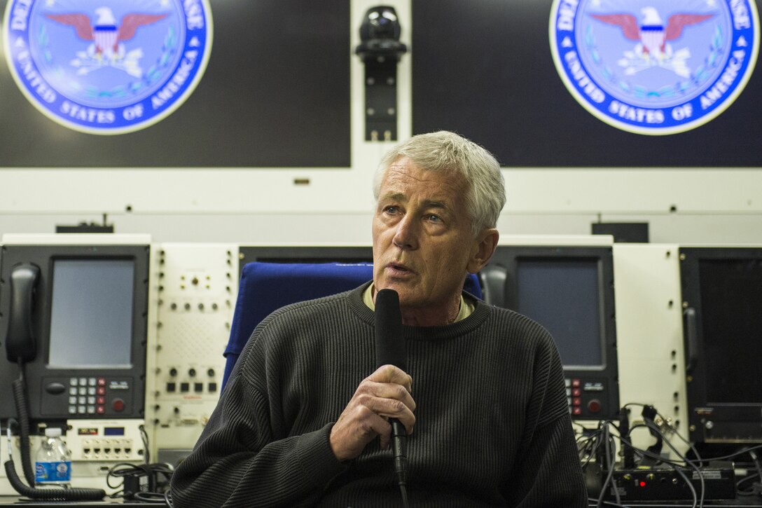 Defense Secretary Chuck Hagel briefs reporters on a flight to New Delhi, Aug. 7, 2014. Hagel is traveling to India to meet new government leaders and pursue opportunities for future cooperation. DoD photo by Navy Petty Officer 2nd Class Sean Hurt