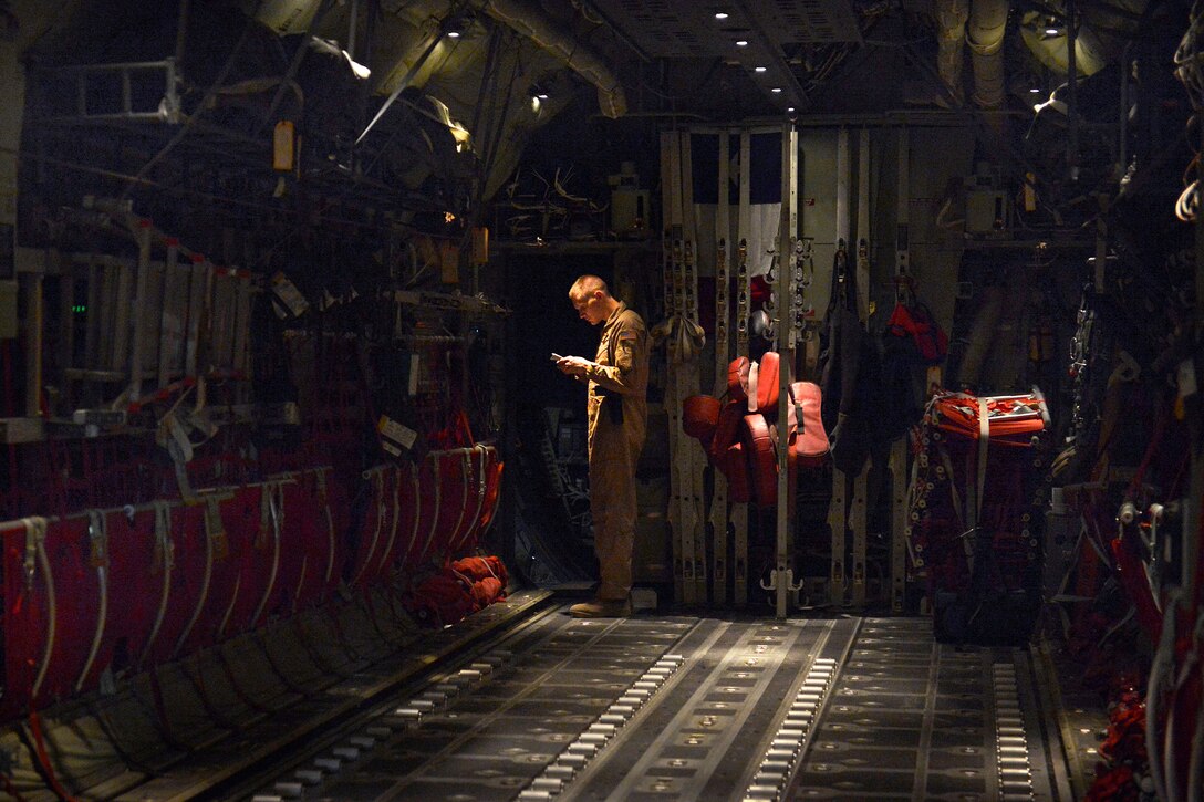 U.S. Air Force Senior Airman Korey King performs pre-flight inspections on a C-130J Super Hercules aircraft before an airdrop on Bagram Airfield, Afghanistan, Aug. 1, 2014. King is a loadmaster assigned to the 774th Expeditionary Airlift Squadron.