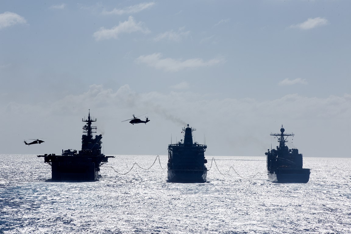 Military Sealift Command fleet replenishment oiler USNS Henry J. Kaiser (T-AO 187) refuels both the USS Makin Island, left, and the USS Comstock, right, as part of an underway replenishmentin the Pacific Ocean, Aug. 4, 2014.  The 11th MEU and Makin Island Amphibious Ready Group are a sea-based, expeditionary crisis response force capable of conducting amphibious missions across the full range of military operations. (U.S. Marine Corps photo by Gunnery Sgt. Rome M. Lazarus/Released) 