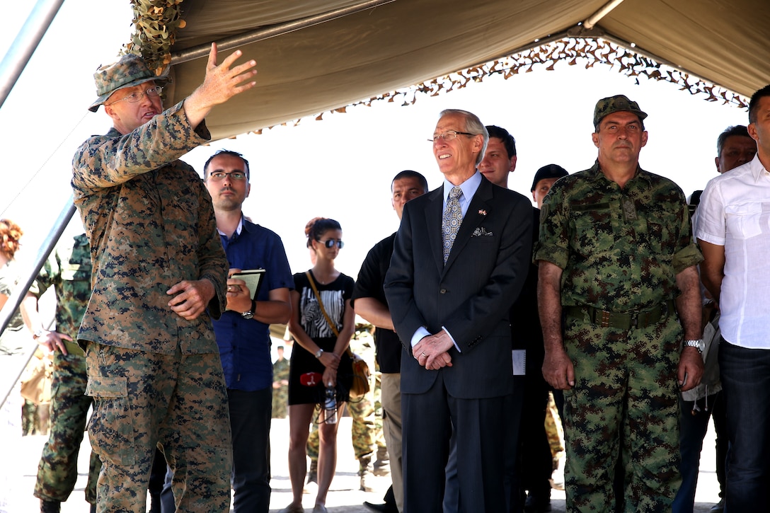 United States Marine Corps 1st Lt. Christopher Howard, a platoon commander with Black Sea Rotational Force 14.2, from 3rd Battalion, 8th Marine Regiment, explains a riot control station to American Ambassador to Serbia Michael Kirby and other distinguished visitors during exercise Platinum Wolf 14 aboard Borovac Training Area, Serbia, July 10, 2014. This is the first iteration of the Platinum Wolf exercise, hosted by Serbia, with members of the Serbian, Croatian, Bulgarian, Romanian, Azerbaijani, Macedonian and United States militaries participating in the exercise. The exercise focused on non-lethal system training and peacetime operations in order to foster greater interoperability with each other while promoting peace and prosperity in the Black Sea, Balkan and Caucasus regions of Eastern Europe. (Official Marine Corps photo by Lance Cpl. Scott W. Whiting, BSRF PAO/ Released)