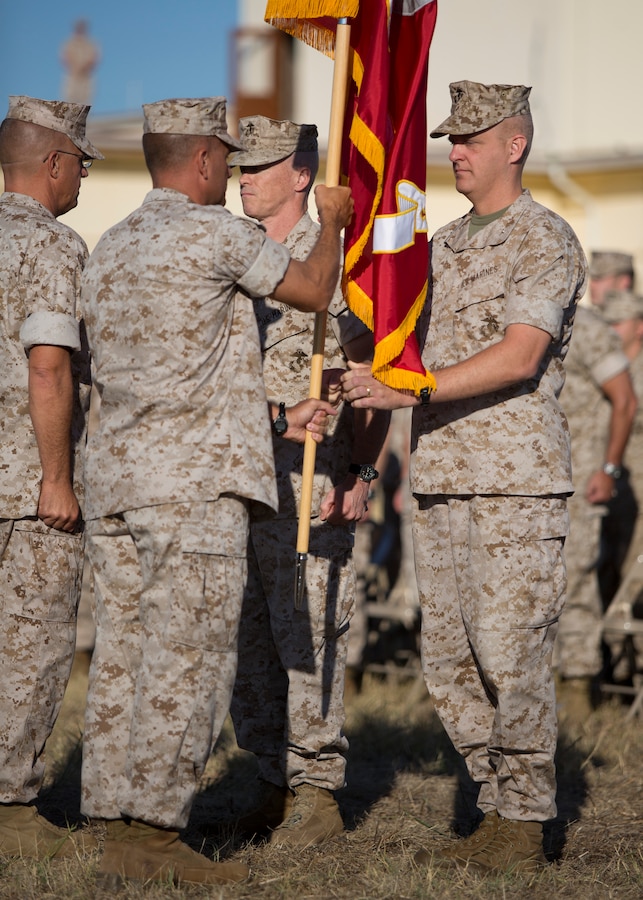 U.S. Marine Corps Sgt.Maj. Scott M. Schmitt (left) 26th Marine Expeditonary Unit (26th MEU) sergeant major prepares to recieve the command flag from commanding officer Col. Robert C. Fulford during the  Special Purpose Marine Air- Ground Task Force Crisis Response (SPMAGTF-CR) transfer of authority ceremony aboard Moron Air Base, Spain, Aug 8, 2014. The purpose of the ceremony was to conduct a proper transition of the SPMAGTF-CR command element from 8th Marine Regiment to the 26th MEU. (U.S. Marine Corps photo by Lance Cpl. Andre Dakis, 26th MEU Combat Camera/Released)