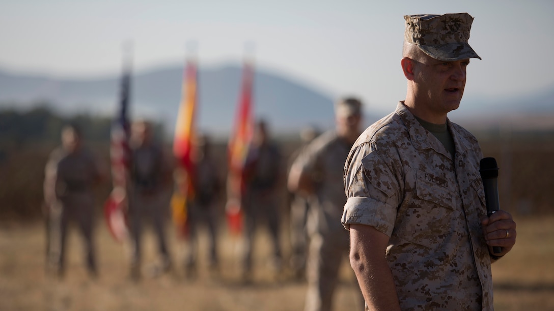 U.S. Marine Corps Col. Robert C. Fulford commanding officer of the 26th Marine Expeditionary Unit (26th MEU) gives a speech during the Special Purpose Marine Air- Ground Task Force Crisis Response (SPMAGTF-CR) transfer of authority ceremony aboard Moron Air Base, Spain, Aug 8, 2014. The purpose of the ceremony was to conduct a proper transition of the SPMAGTF-CR command element from 8th Marine Regiment to the 26th MEU. (U.S. Marine Corps photo by Lance Cpl. Andre Dakis, 26th MEU Combat Camera/Released)