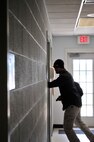 Jacob Smith, the mission assurance director for MCAF, acts as an active shooter during a training exercise conducted at Marine Corps Air Facility Quantico.  Conducted at several buildings at the air station, Smith went through each checking for unlocked hatches and “shooting” those behind them. The purpose of the exercise was to give Marines and civilian employees an opportunity to exercise their plans and procedures in the event of an active shooter aboard the air facility. 