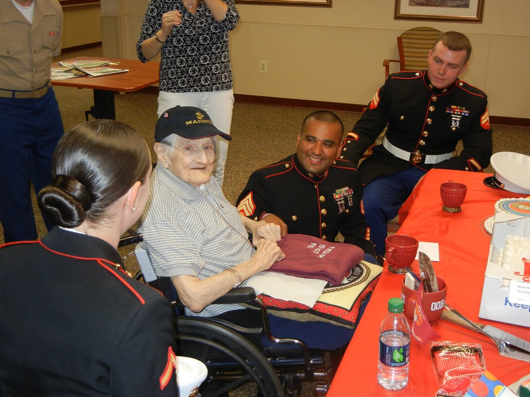 Marines from MCB Quantico chat with retired Mastery Gunnery Sgt. John H. Deters at a party to celebrate his 88th birthday in Fredericksburg on Aug. 2. Deters is a World War II veteran who served at both Okinawa and Iwo Jima.