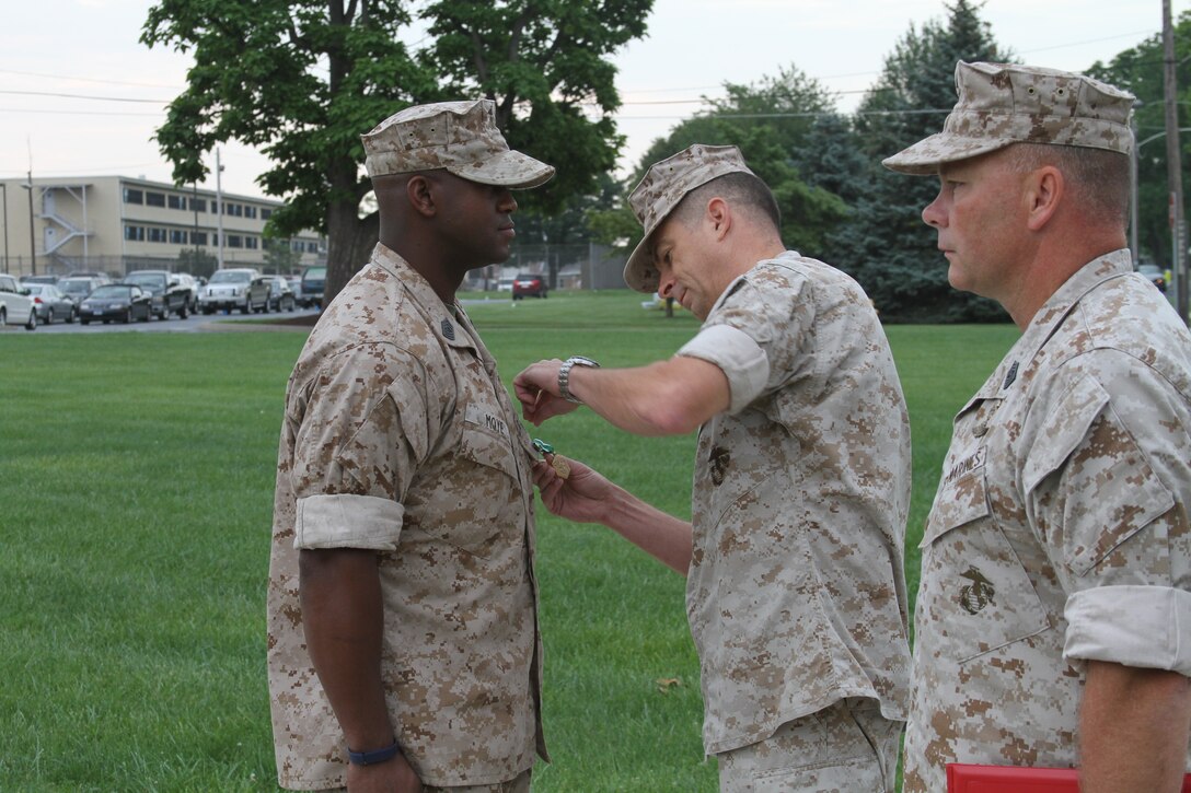 U.S. Marine Corps Master Sgt. Tommy Moye, a native of Quincy, Fla. and 1991 graduate of James A. Shanks High School, recieves the Navy and Marine Corps Commendation Medal Aug. 6, 2014.  Moye served as a 4th Marine Corps District training team member at the Defense Distribution Center Susquehanna in New Cumberland, Pa. As a training team member, he was responsible for monitoring and inspecting Recruiting Stations and Recruiting Sub-Stations across the district to ensure that systematic recruiting is a constant practice. Moye executed Permanent Change of Station orders to RS Raleigh and will now become the RI for RS Raleigh to ensure the recruiters of RS Raleigh recruit and enlist the most eligible for the U.S. Marine Corps. (U.S. Marine Corps photo by Cpl. Tyler Birky/Released)