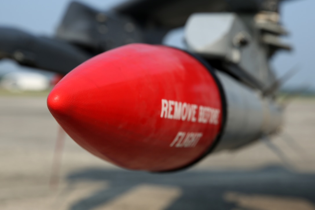 An AIM-120A advanced medium-range air-to-air missile is secured aboard an AV-8B Harrier with Marine Attack Squadron 223 at Marine Corps Air Station Cherry Point, N.C., Aug. 7, 2014. 
VMA-223 conducted the first East Coast Harrier squadron AMRAAM firing exercise off the coast of Oceana, Va., to help the squadron enhance its mission readiness. While the primary mission of VMA-223 is air-to-ground attack support for the Marine Air-Ground Task Force from the sea or land, the squadron's AV-8B pilots train to engage airborne enemies beyond visual range with radar guided air-to-air missiles. 