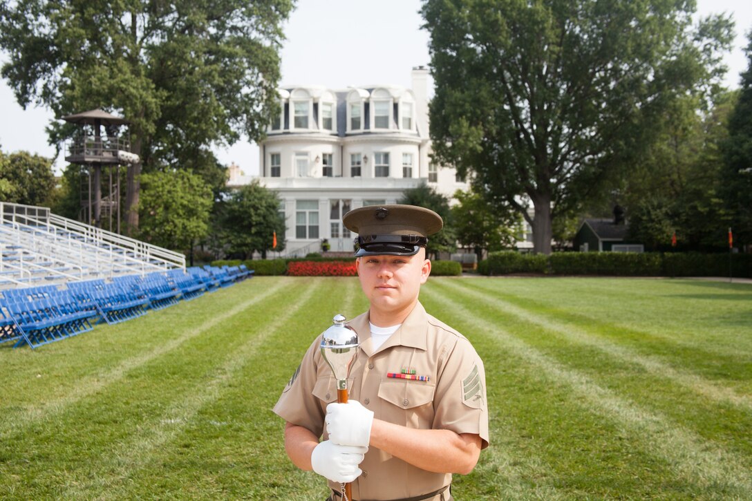 Washington, D.C.-
The Drum Major is a respected and coveted position within the United States Marine Drum & Bugle Corps. Master Gunnery Sgt. Kevin Buckles is the current Drum Major and Senior Enlisted Advisor of the unit. Each year one NCO is chosen through an arduous audition to fill the role of the Drum Major and represent the D&B during the NCO Tuesday Sunset Parade which will be held on 12 August at the Marine Corps War Memorial in Arlington, VA. The representative for the 2014 NCO Sunset Parade is Sgt. Matthew Moyer. 
In reference to being chosen as the NCO Drum Major, Sgt. Moyer stated "It is a chance to showcase what NCO's in the Corps' can do." Every key billet in the 12 August parade will be filled by NCOs from Marine Barracks Washington, D.C. Positions traditionally held by senior Staff NCO's and Officers. (Photo By: Staff Sgt. Joshua D. Miles/Released)


