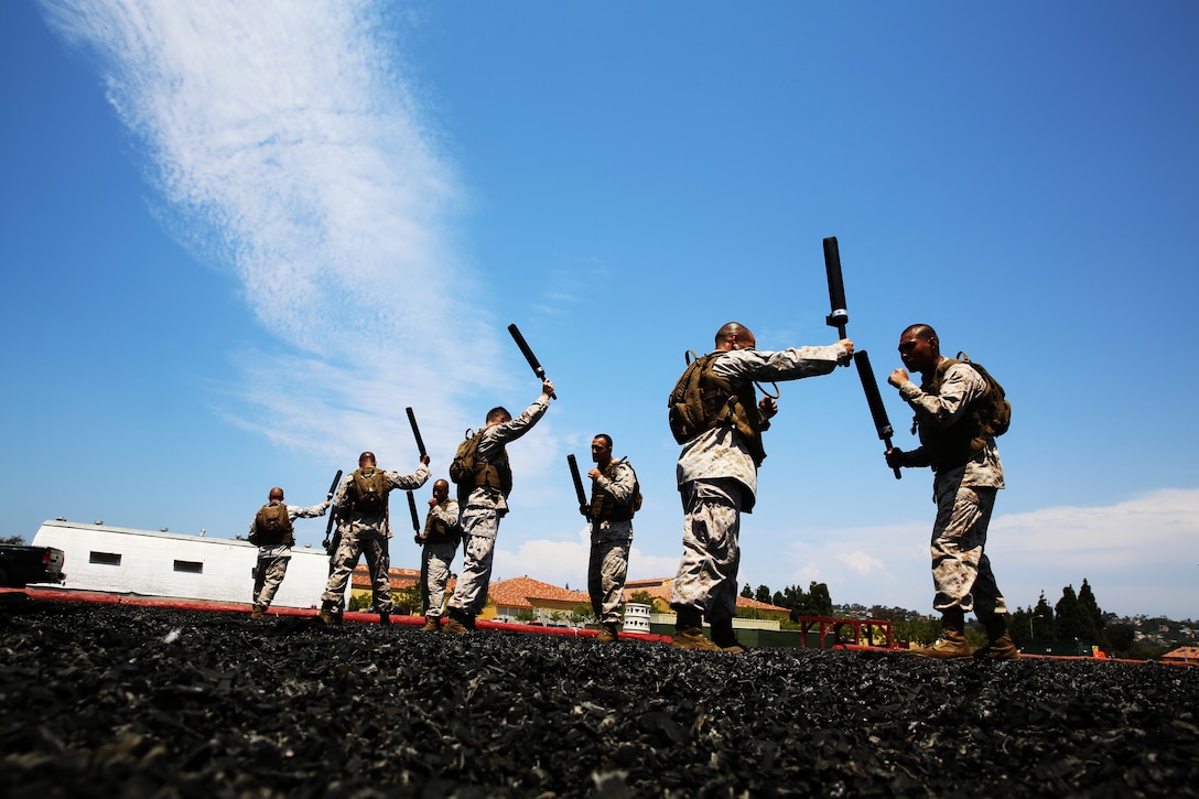 Students of the Martial Arts Instructor Course, practice techniques from the Marine Corps Martial Arts Program green belt syllabus at Marine Corps Recruit Depot San Diego, Aug. 1, 2014. After each class, the Marines conduct guided discussions featuring past warriors and Marines who have paid the ultimate sacrifice.