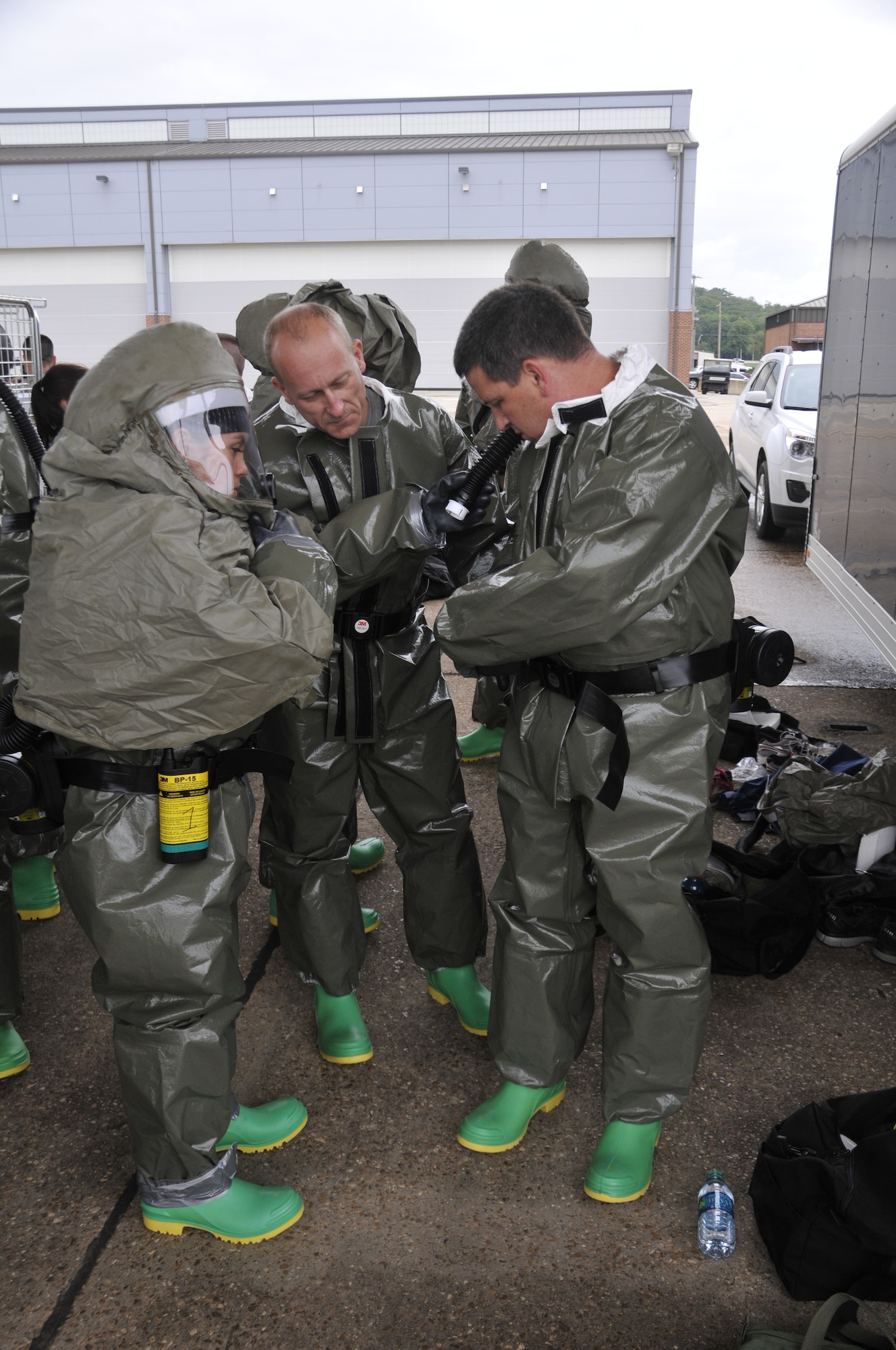 Airmen from the 188th Wing practice decontaminating a victim of a contamination scenario during decontamination training at Ebbing Air National Guard Base, Arkansas, July 17. The volunteers, who were from various parts of the wing, learned how to set up a decontamination tent and clean victims of various chemical or nuclear hazards. This training will aid the wing in its mission to support Arkansas citizens in times of disaster. (U.S. Air National Guard photo by Staff Sgt. John Suleski/released)