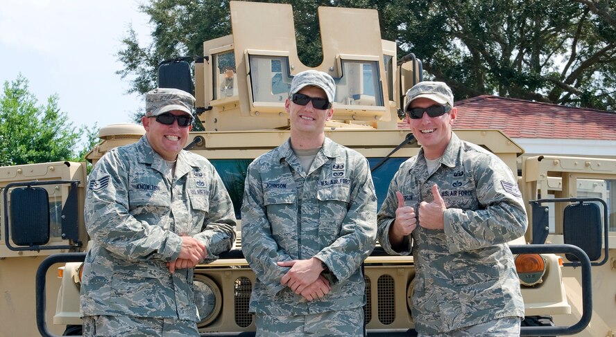 Airmen from the 1st Special Operations Civil Engineer Squadron pose for a photo during the 16th Annual Truck Day at the Destin Community Center in Destin, Fla., Aug. 7, 2014. Air Commandos participate in various events like Truck Day in support of the local community and to educate the public on the mission at Hurlburt Field. (U.S. Air Force photo/Senior Airman Kentavist P. Brackin)