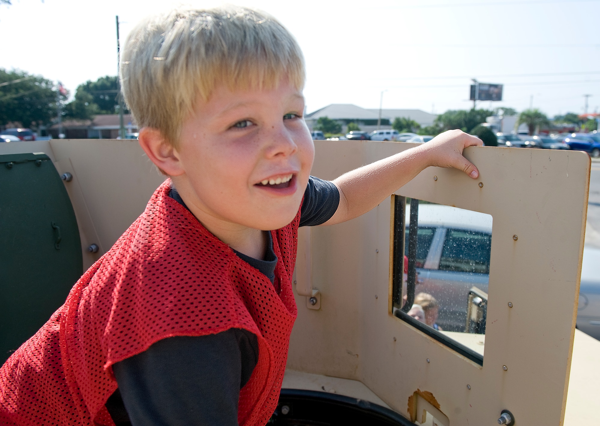 Nolan Kirby, age six, explores the gun turret of a 1st Special Operations Civil Engineer Squadron Humvee at the 16th Annual Truck Day at the Destin Community Center in Destin, Fla., Aug. 7, 2014. Airmen aided children in exploring various parts of the Humvee throughout the morning to help better their understanding of the equipment the military uses. (U.S. Air Force photo/Senior Airman Kentavist P. Brackin)