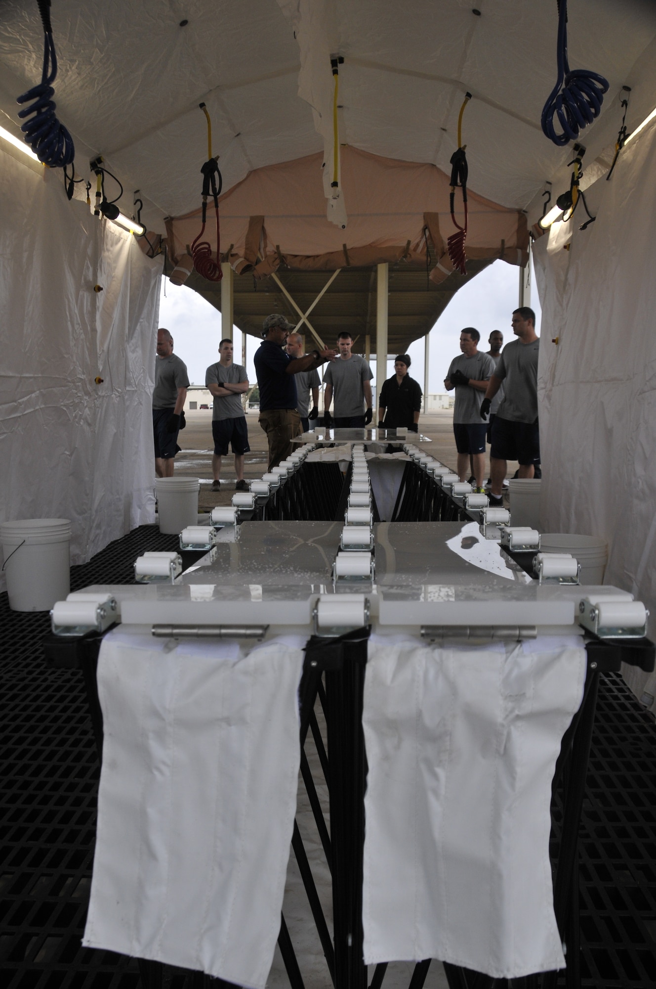 Airmen from the 188th Wing attend decontamination training at Ebbing Air National Guard Base, Arkansas, July 17. The volunteers, who were from various parts of the wing, learned how to set up a decontamination tent and clean victims of various chemical or nuclear hazards. This training will aid the wing in its mission to support Arkansas citizens in times of disaster. (U.S. Air National Guard photo by Staff Sgt. John Suleski/released)